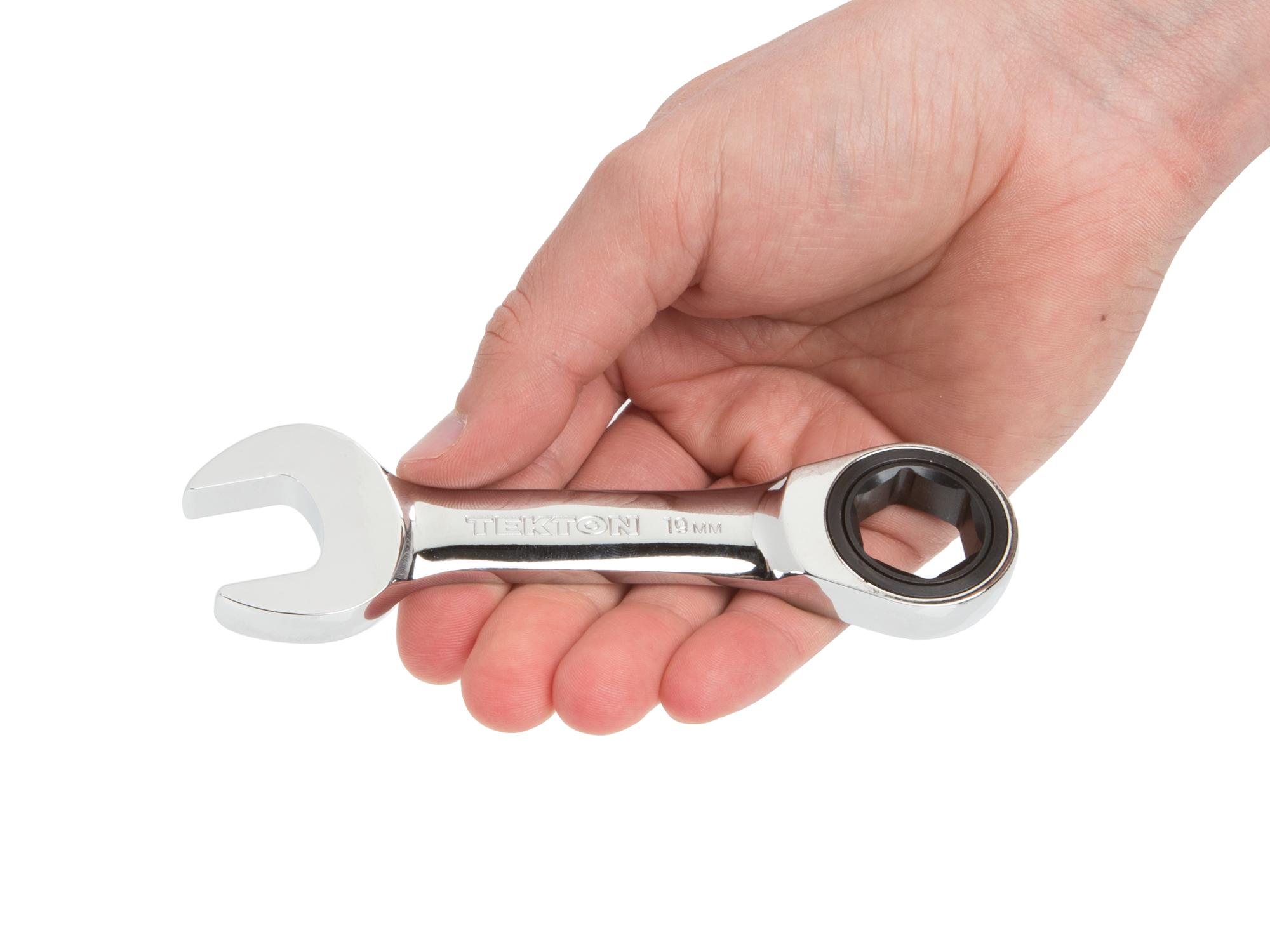Person holding Tekton ratcheting combination wrench. Item #WRN50119