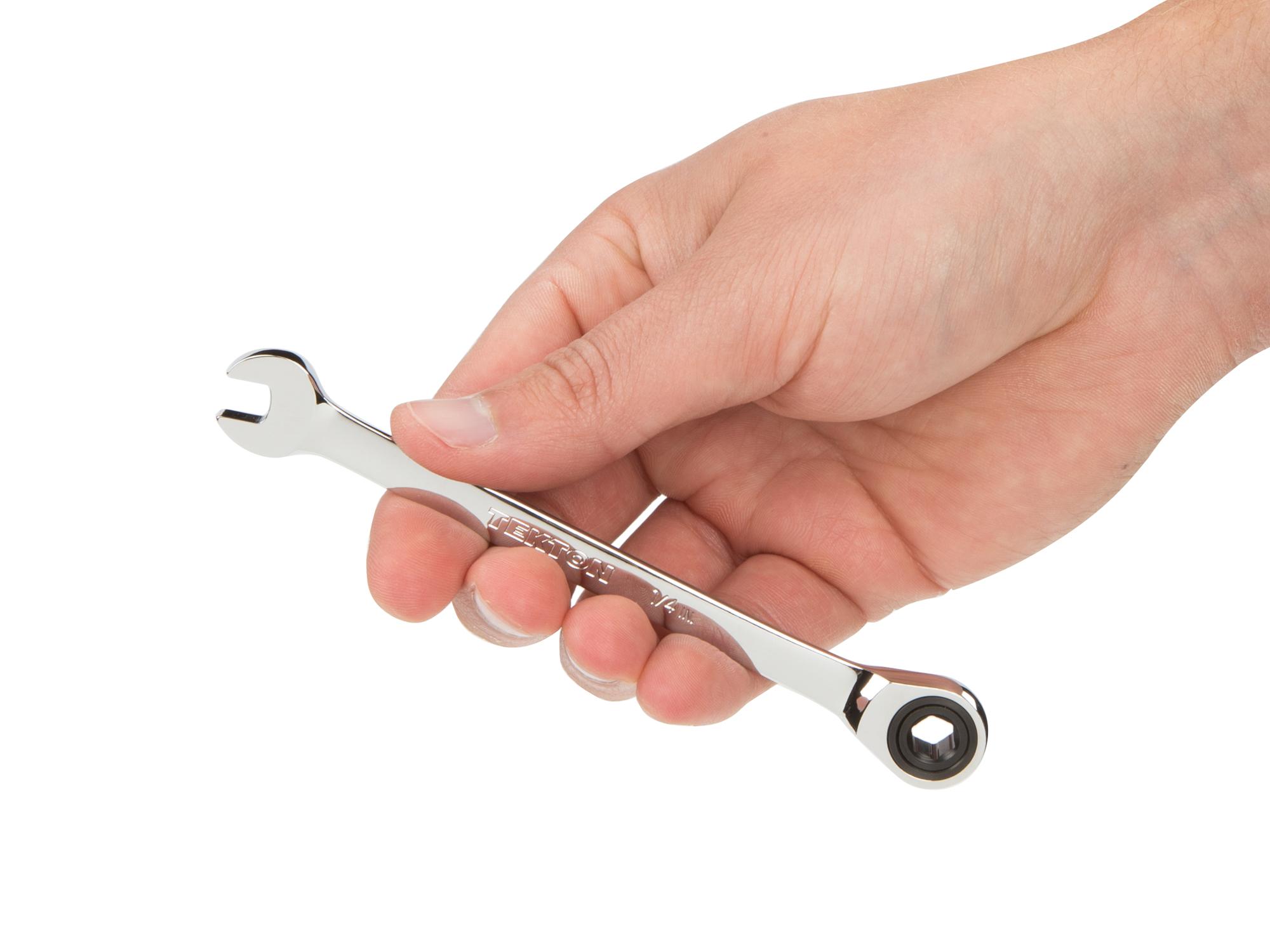 Person holding Tekton ratcheting combination wrench. Item #WRN53004
