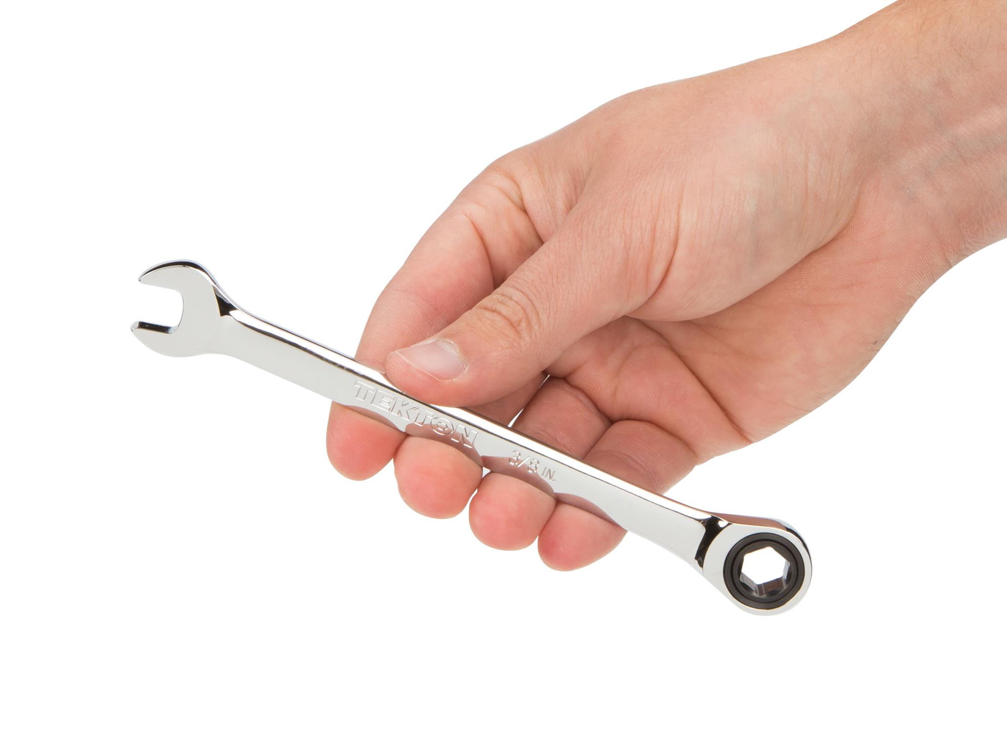 Person holding Tekton ratcheting combination wrench. Item #WRN53008
