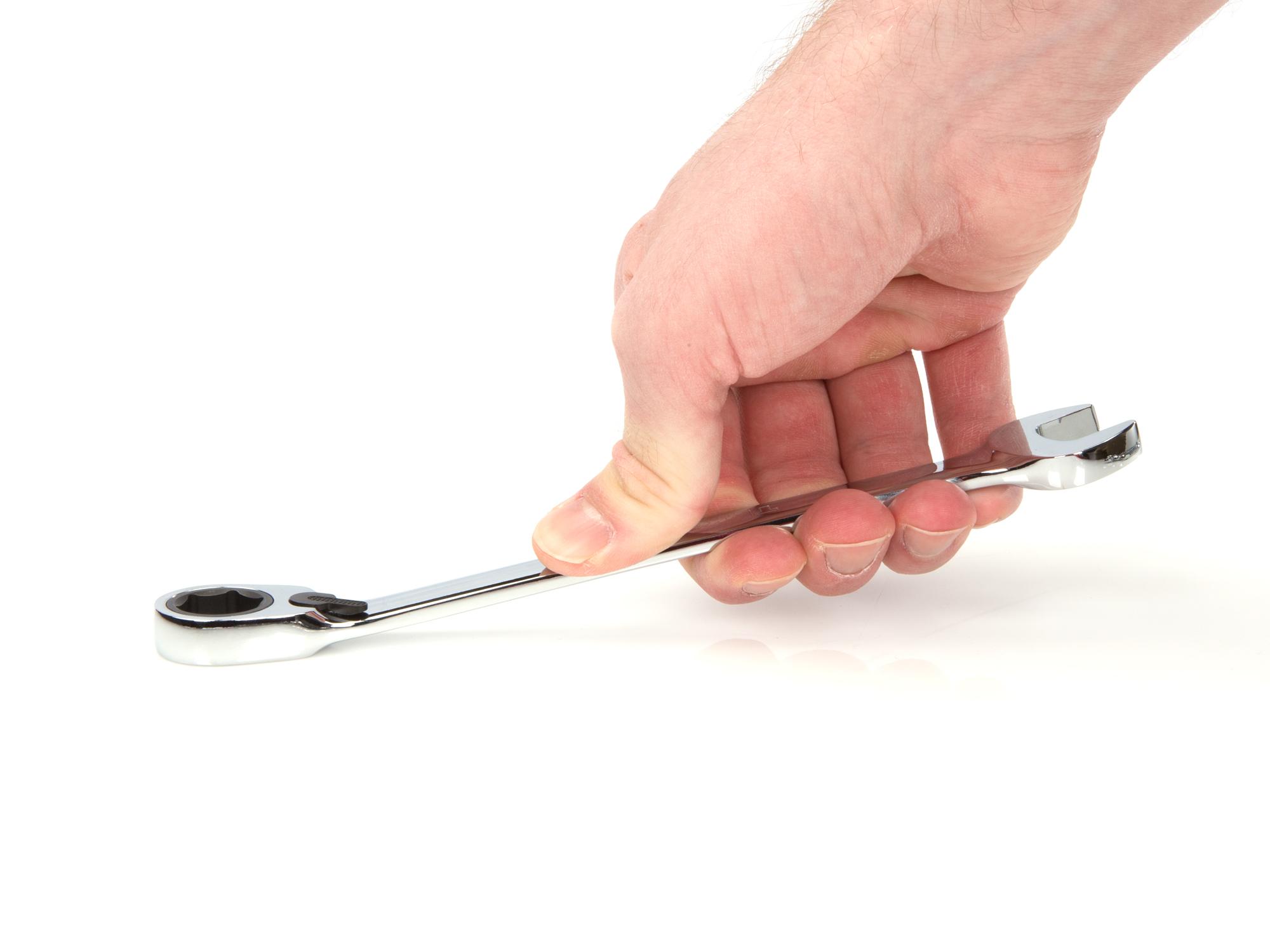 Person holding Tekton ratcheting combination wrench. Item #WRN56013