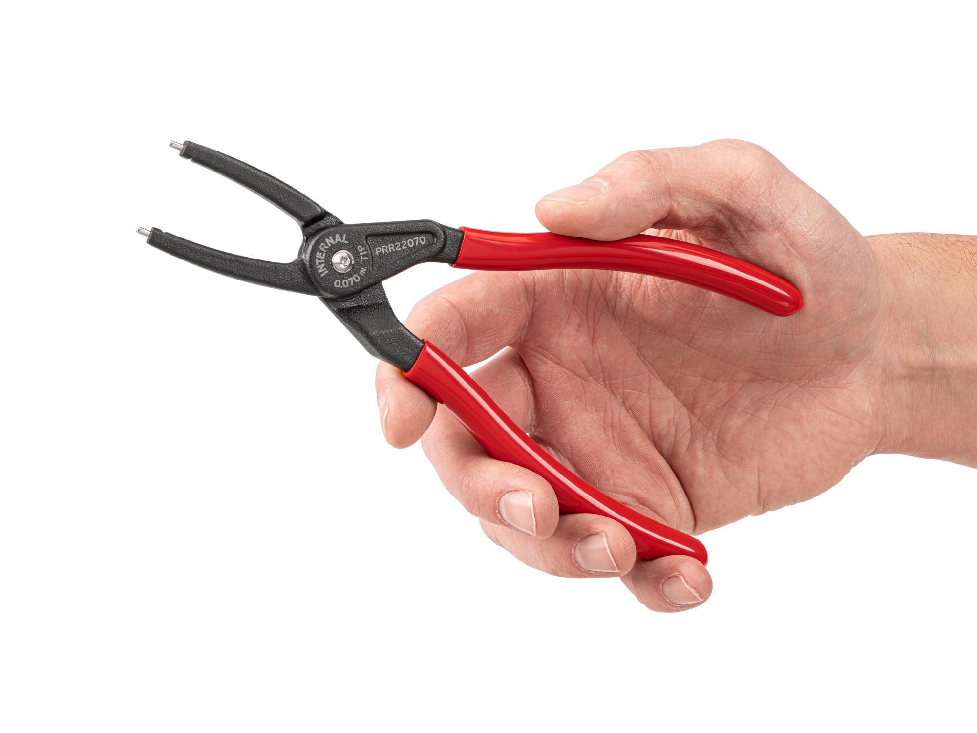Person holding Tekton 7 inch retaining ring pliers. Item #PRR22070