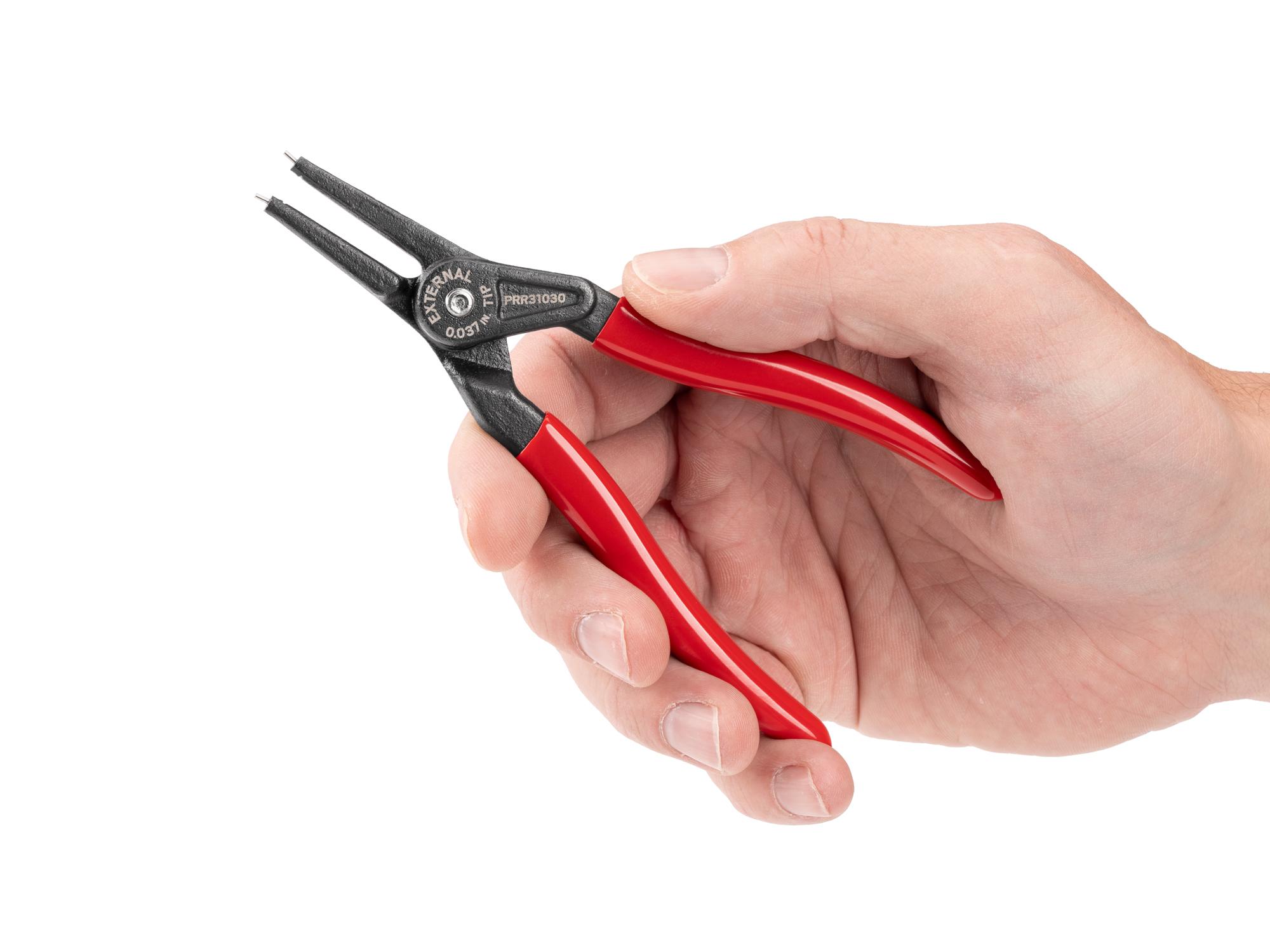 Person holding Tekton 5 inch retaining ring pliers. Item #PRR31030