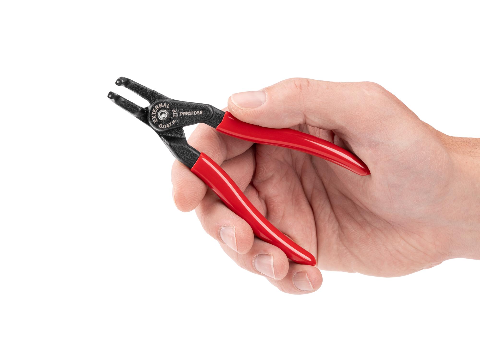 Person holding Tekton 5 inch retaining ring pliers. Item #PRR31055