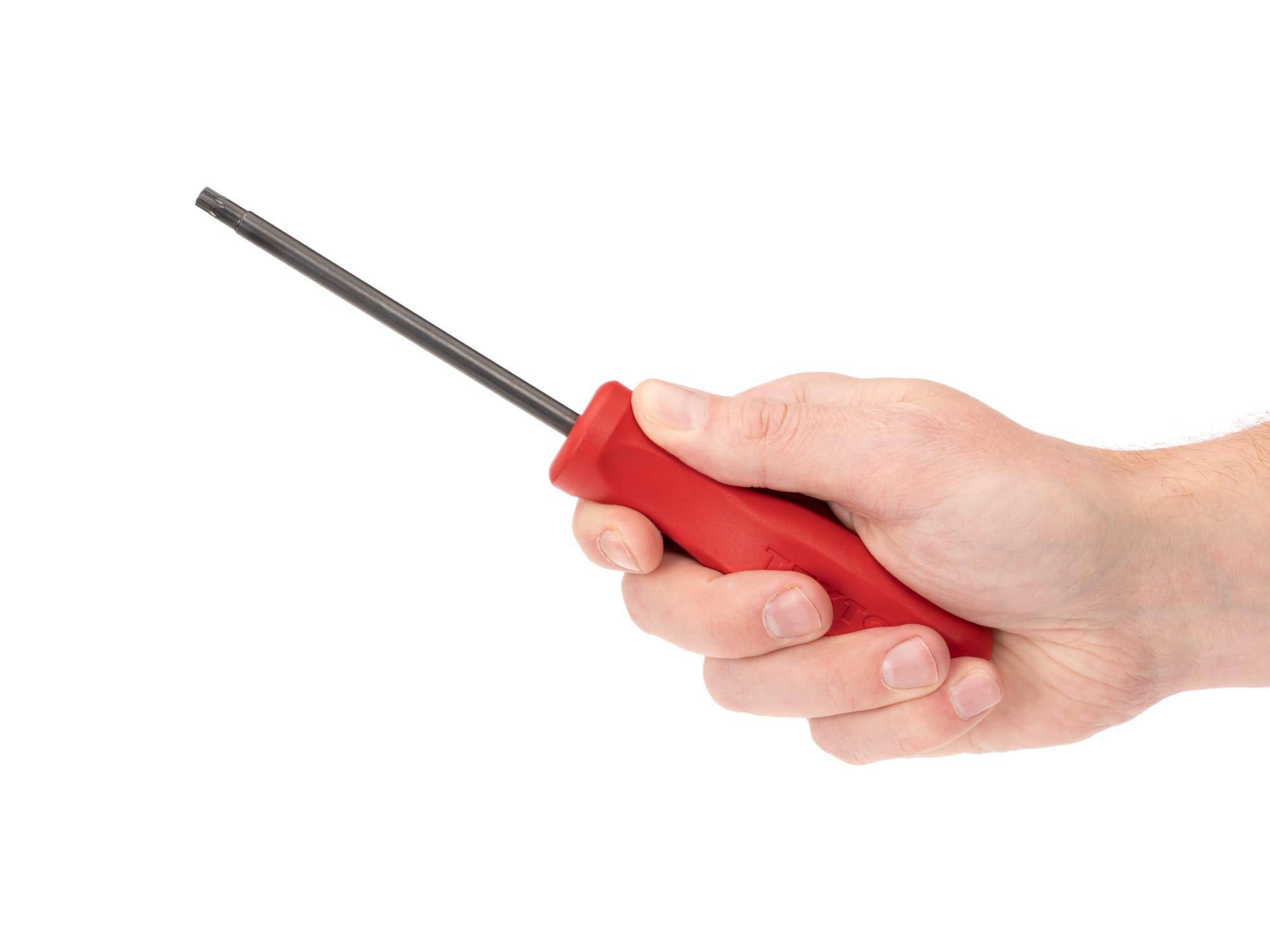 Person holding Tekton screwdriver. Item #DST11300