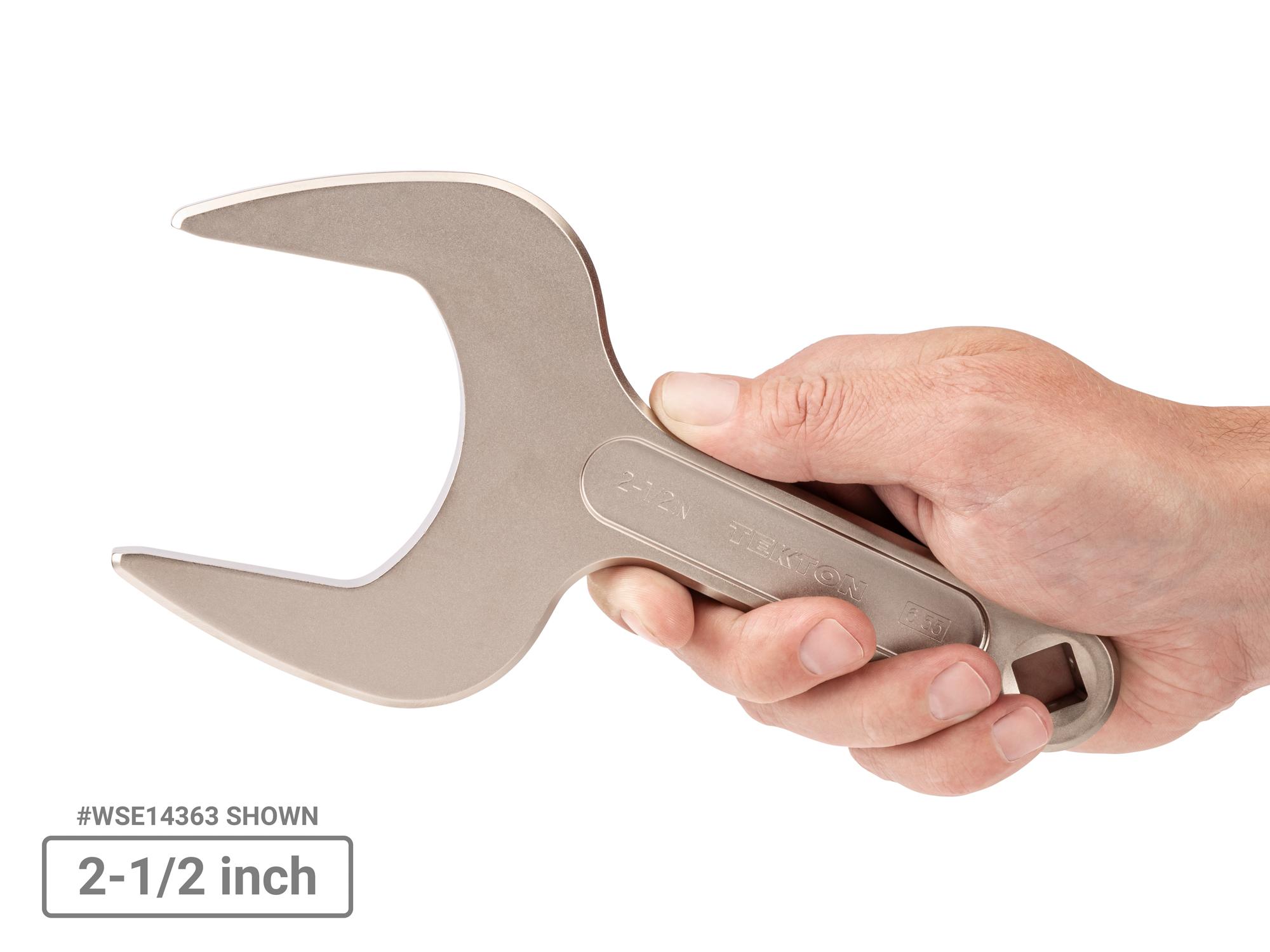 Person holding Tekton service wrench set. Item #WSE90103