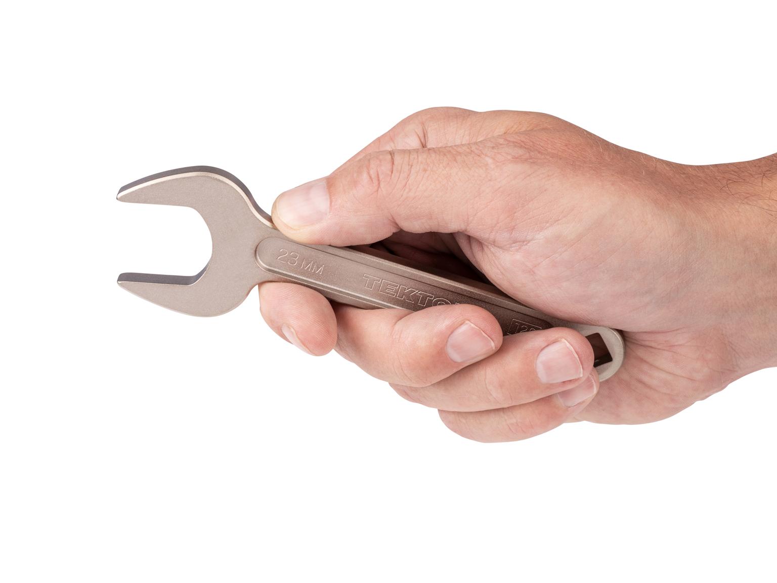 Person holding Tekton 23 millimeter service wrench set. Item #WSE14423
