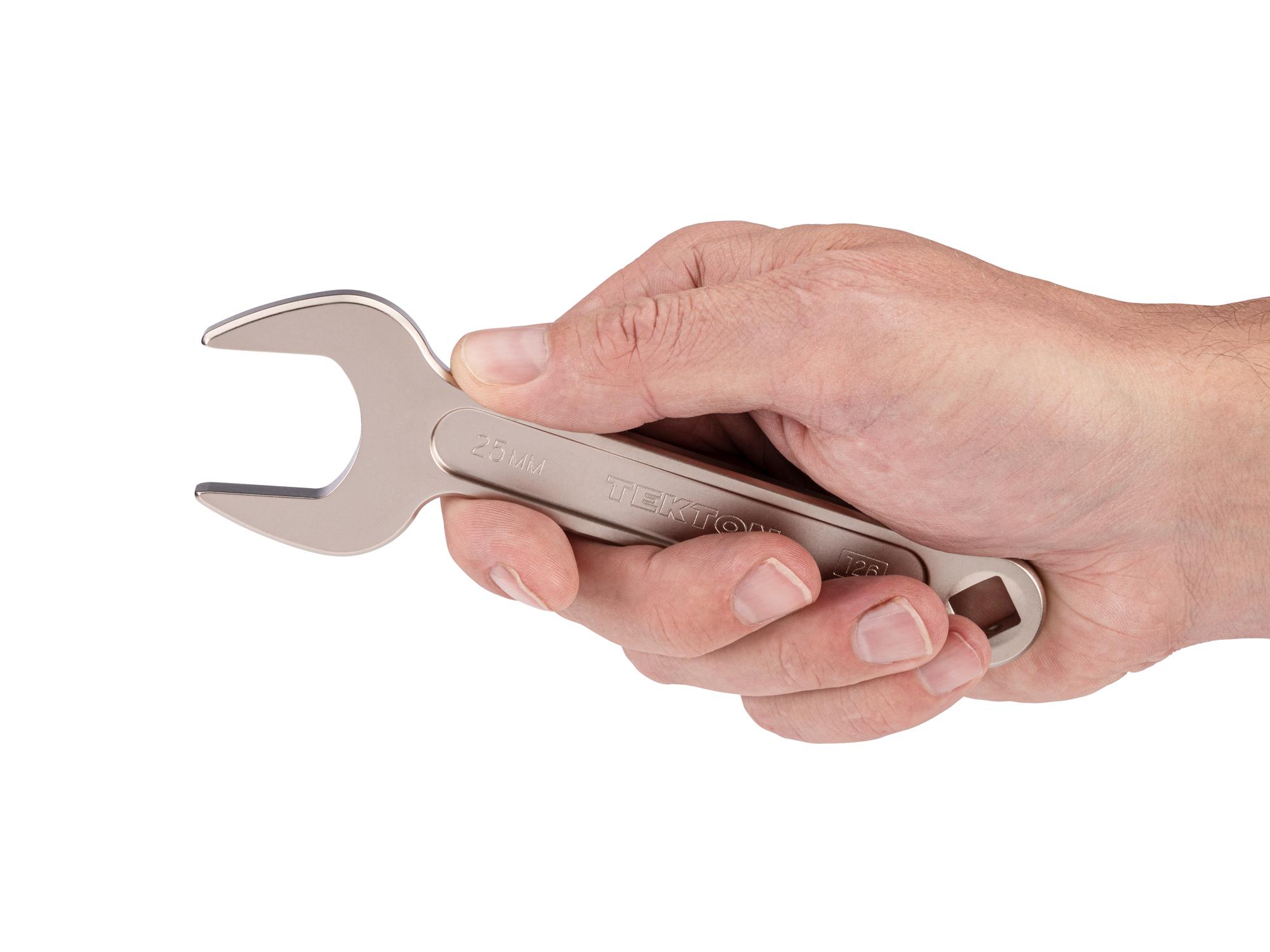 Person holding Tekton service wrench. Item #WSE14425