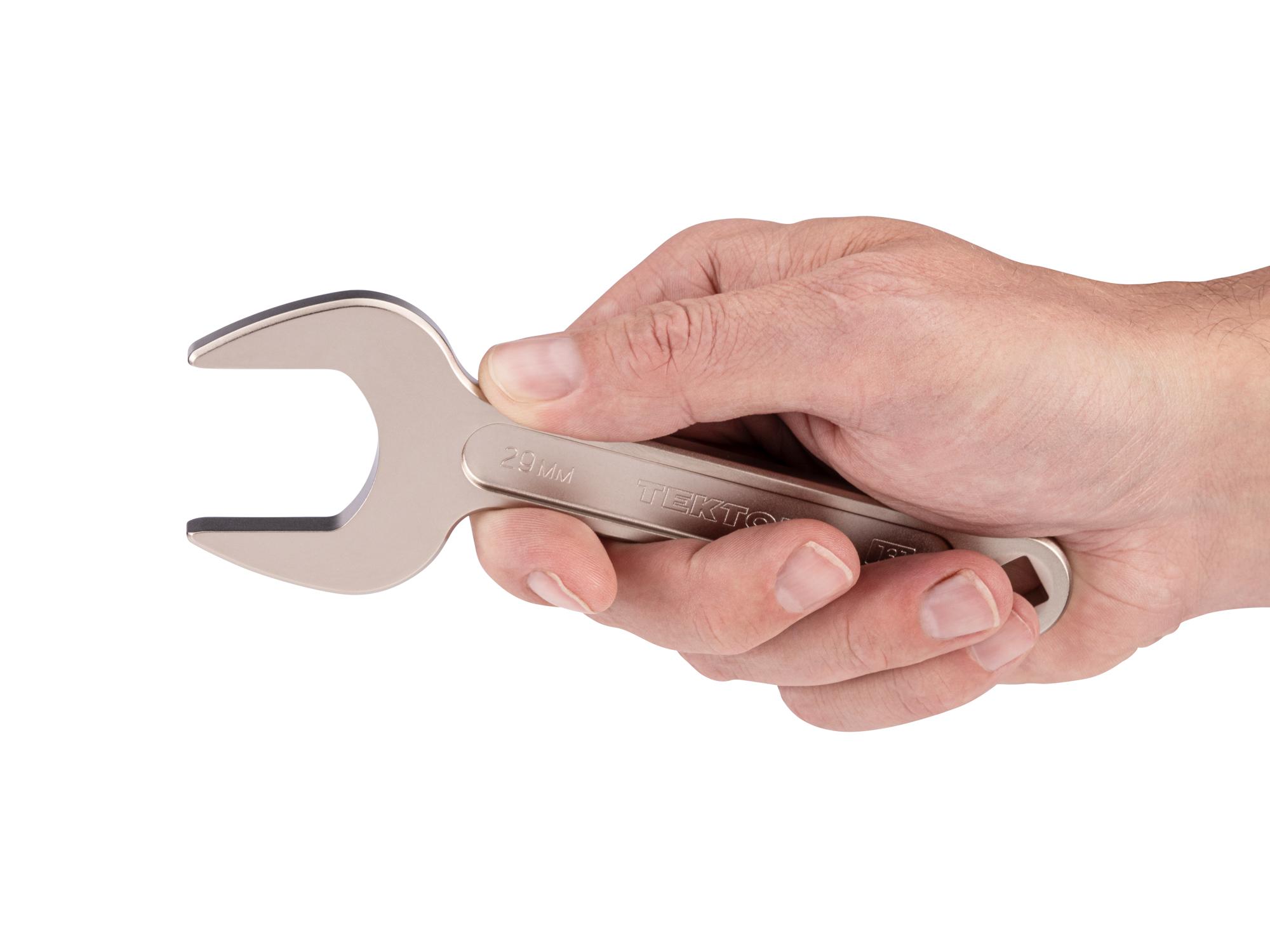 Person holding Tekton service wrench. Item #WSE14429