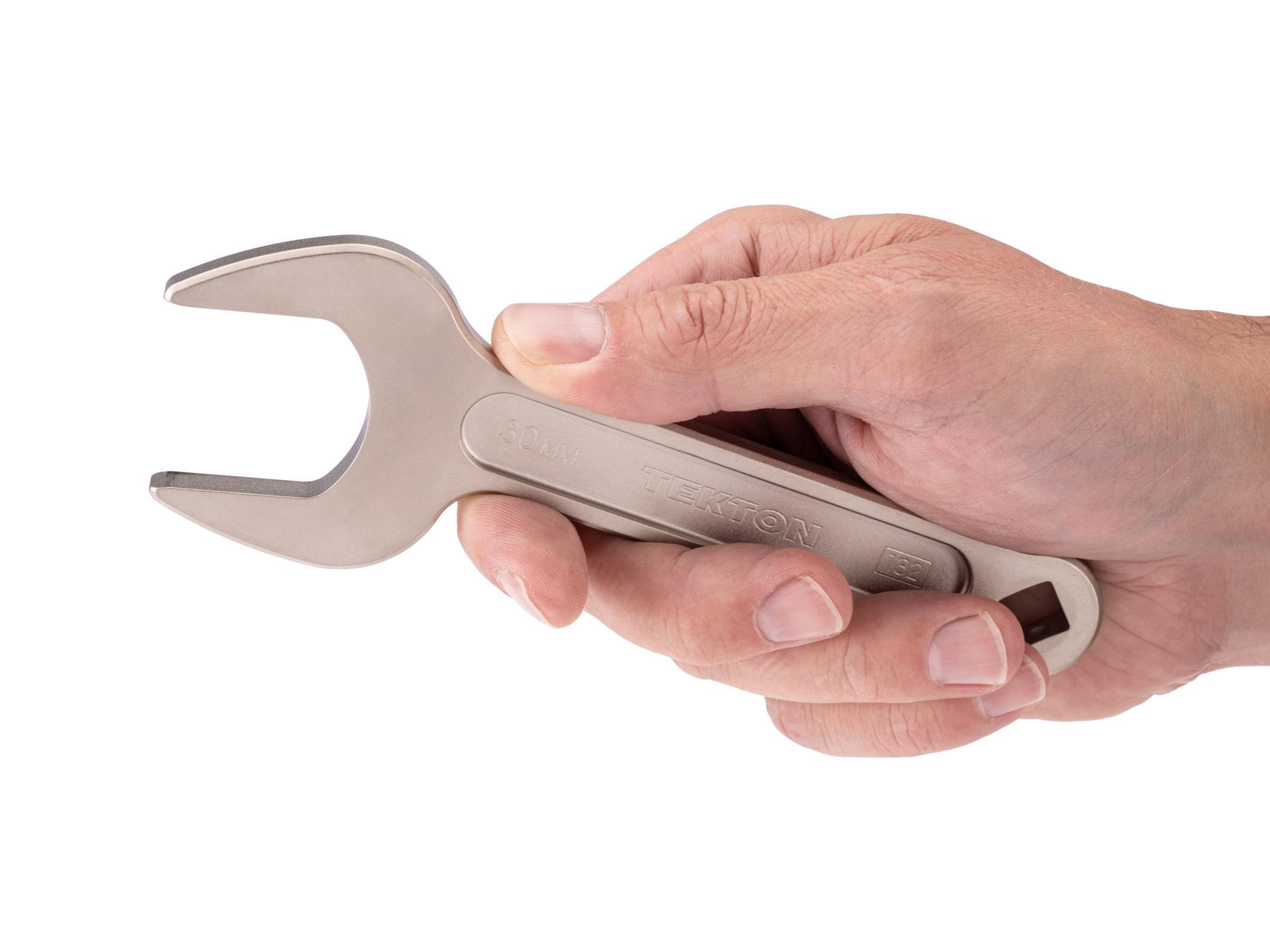 Person holding Tekton service wrench. Item #WSE14430