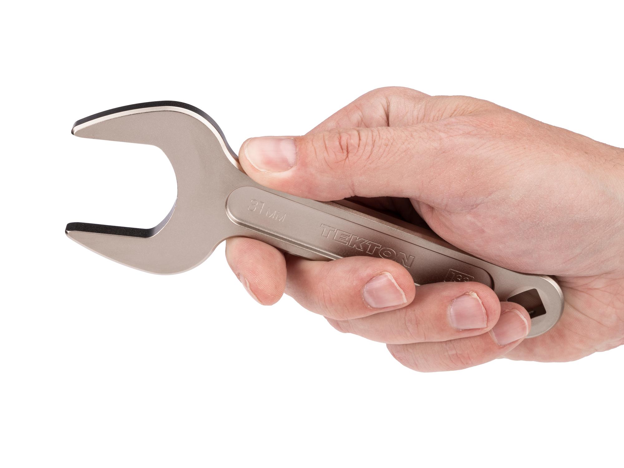 Person holding Tekton service wrench. Item #WSE14431
