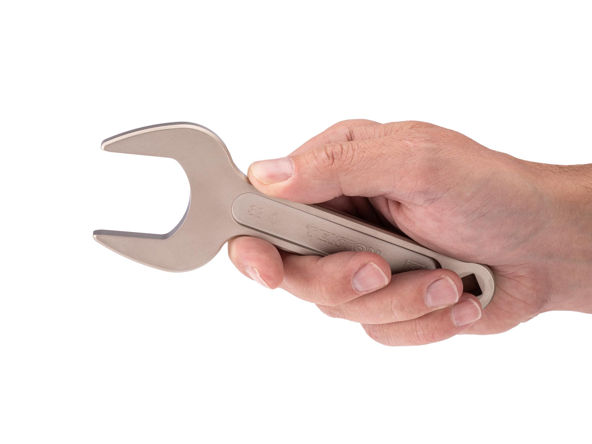 Person holding Tekton service wrench. Item #WSE14432