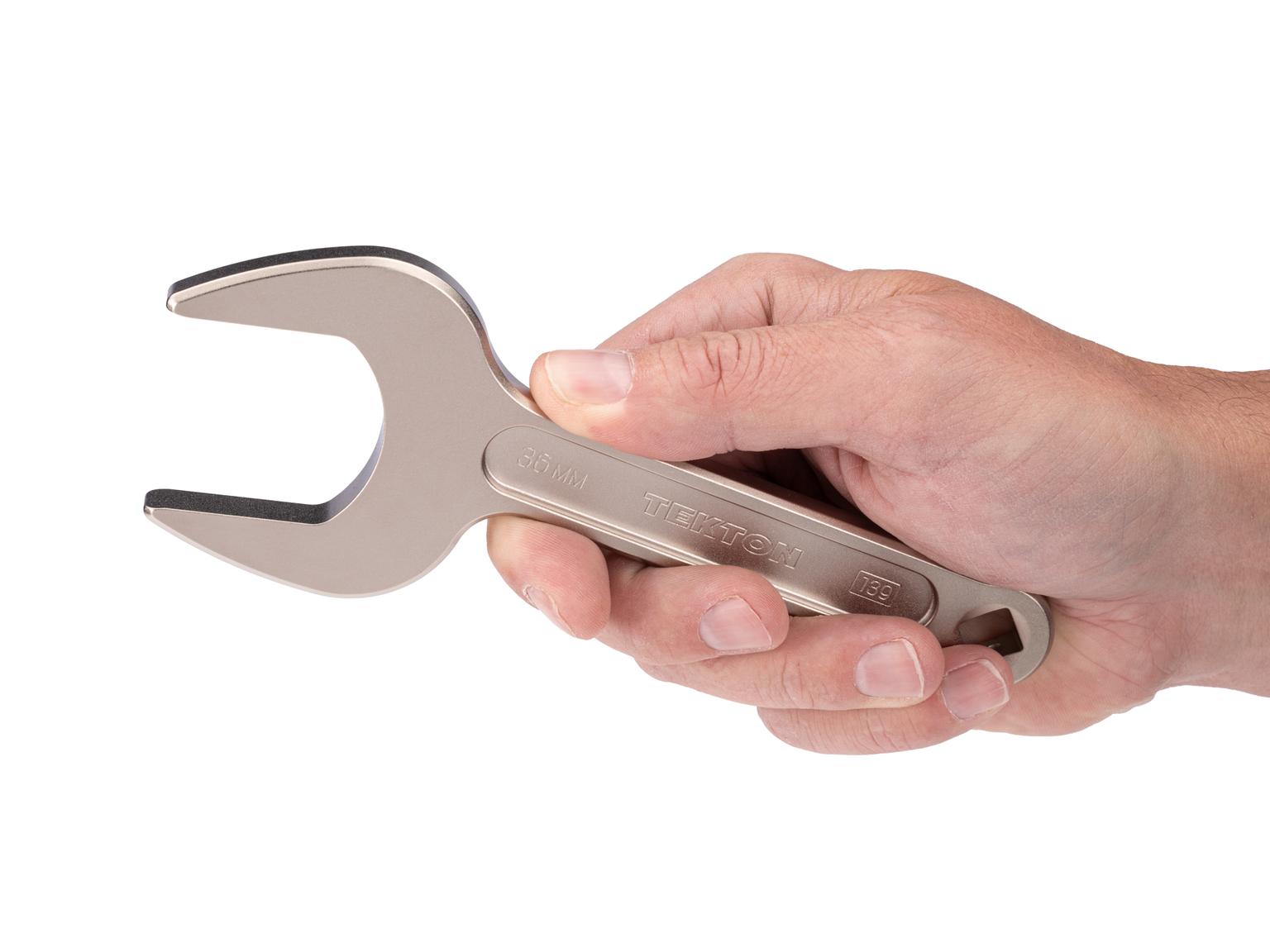 Person holding Tekton 36 millimeter service wrench set. Item #WSE14436