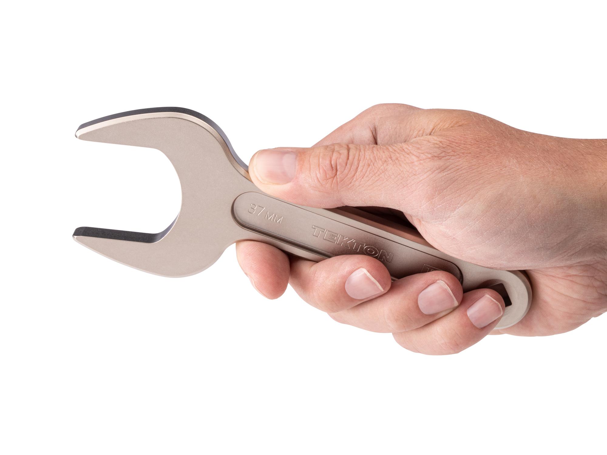 Person holding Tekton service wrench. Item #WSE14437
