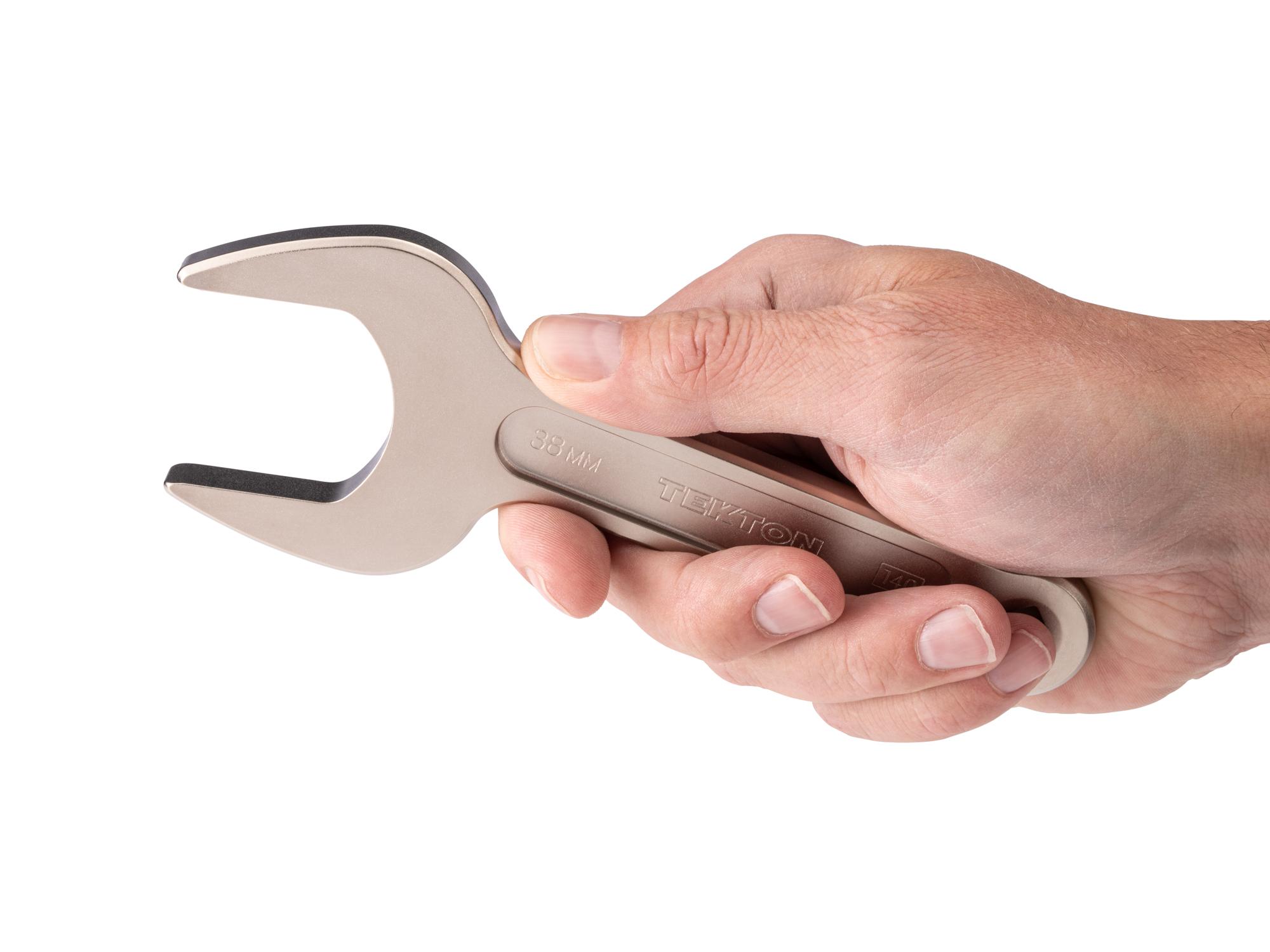 Person holding Tekton service wrench. Item #WSE14438