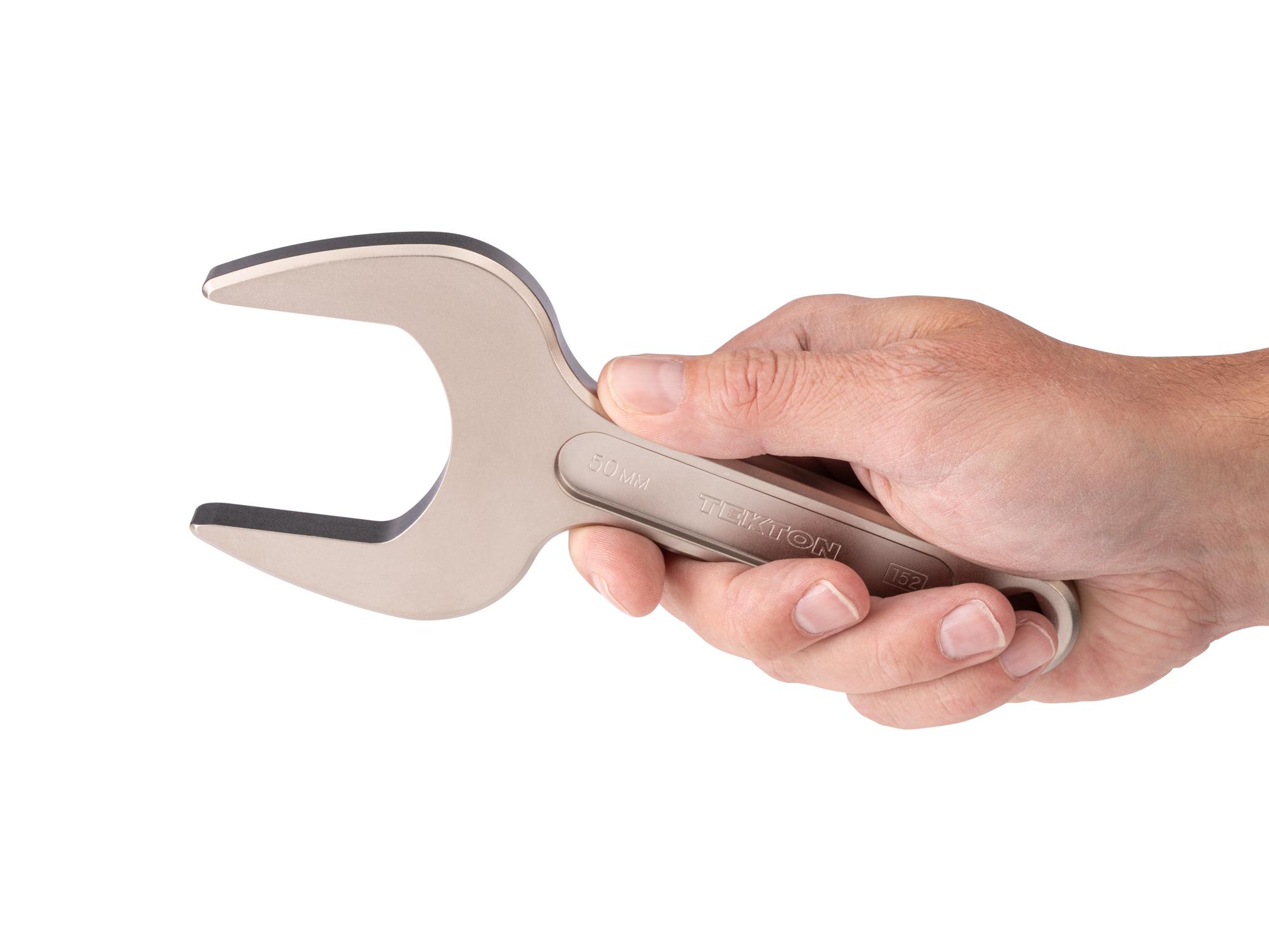 Person holding Tekton service wrench. Item #WSE14450