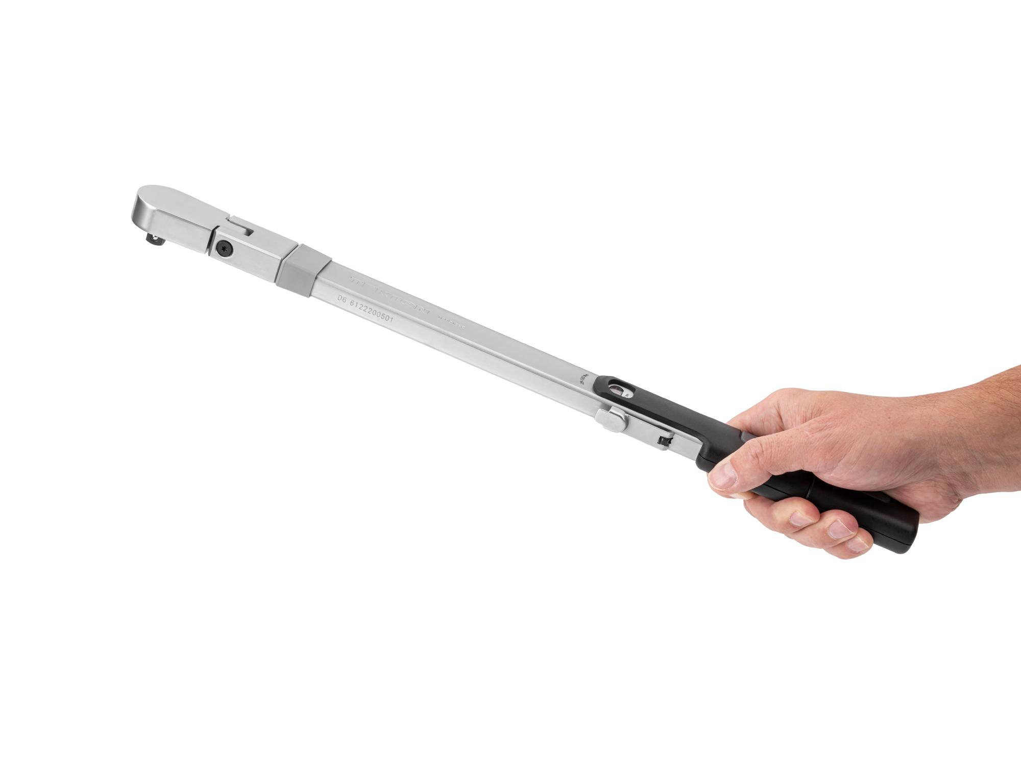 Person holding Tekton case split beam torque wrench. Item #TRQ61222
