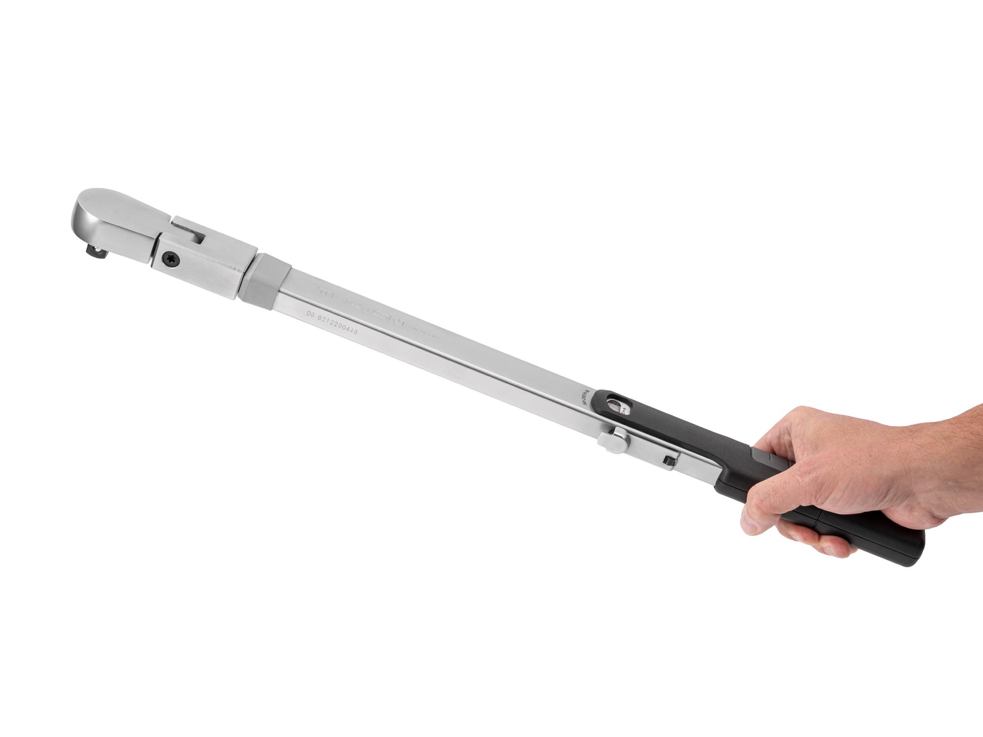 Person holding Tekton case split beam torque wrench. Item #TRQ62122