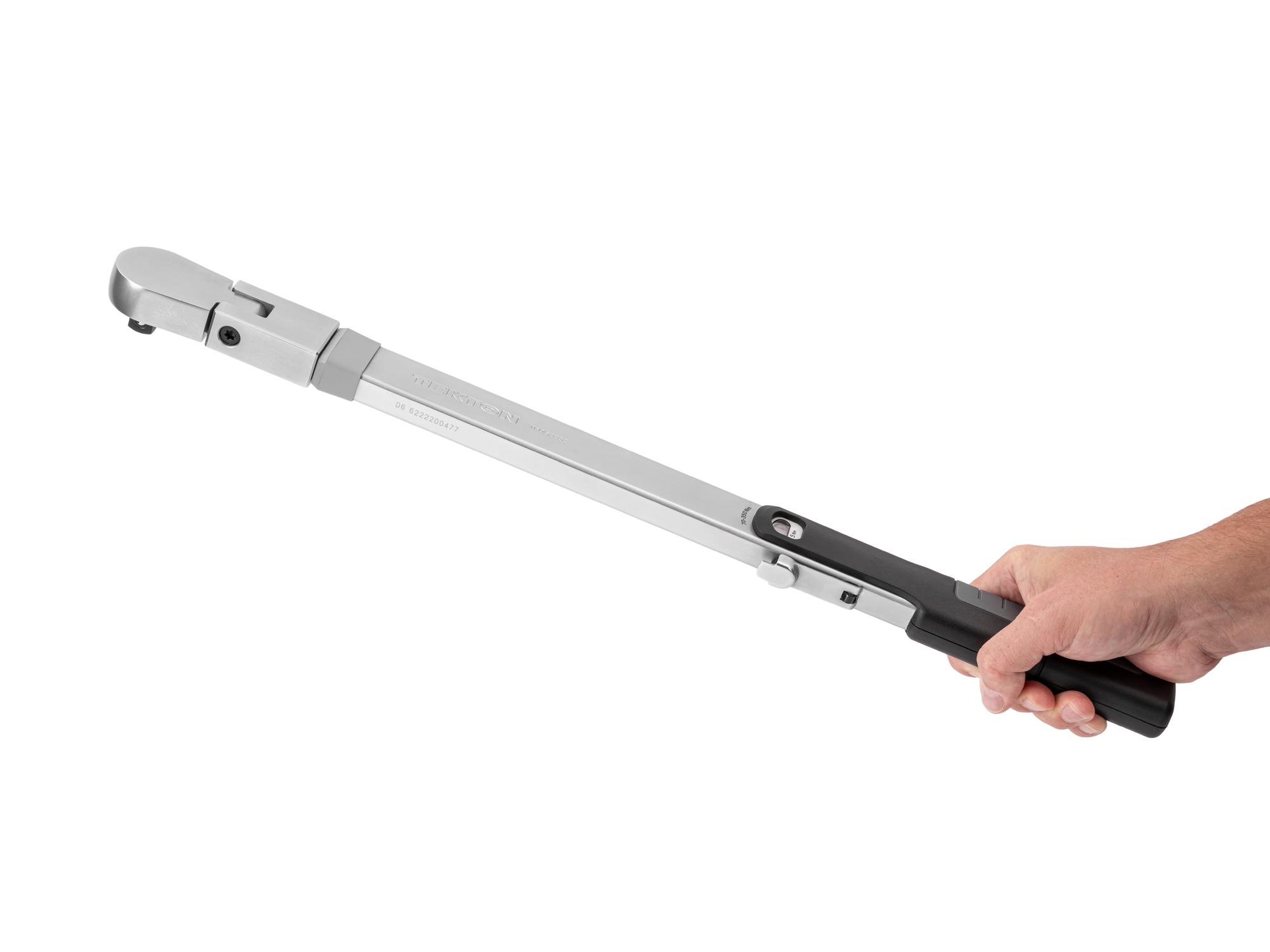 Person holding Tekton case split beam torque wrench. Item #TRQ62222