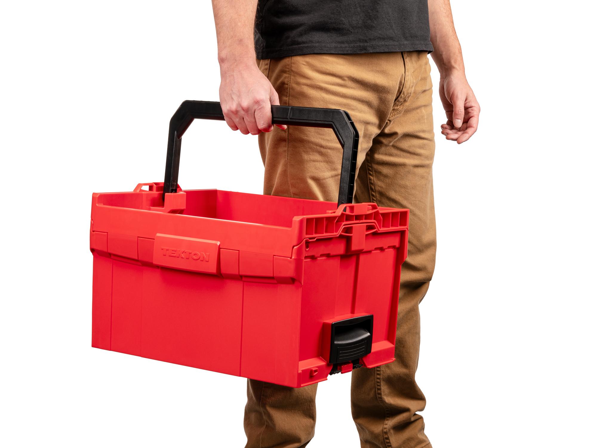 Person holding Tekton stacking organization system. Item #OLB21023.