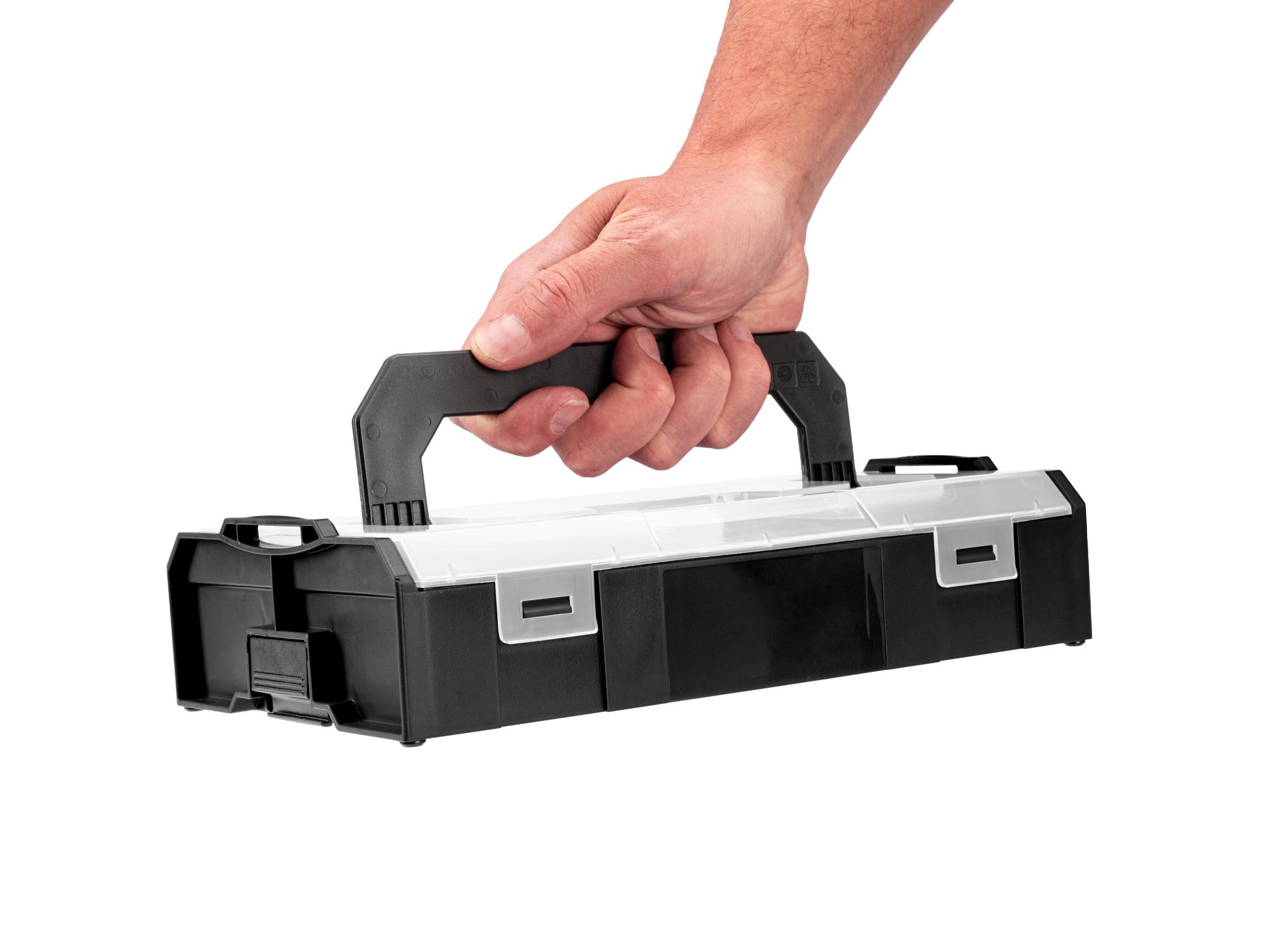 Person holding black Tekton stacking organization system. Item #OLM21011