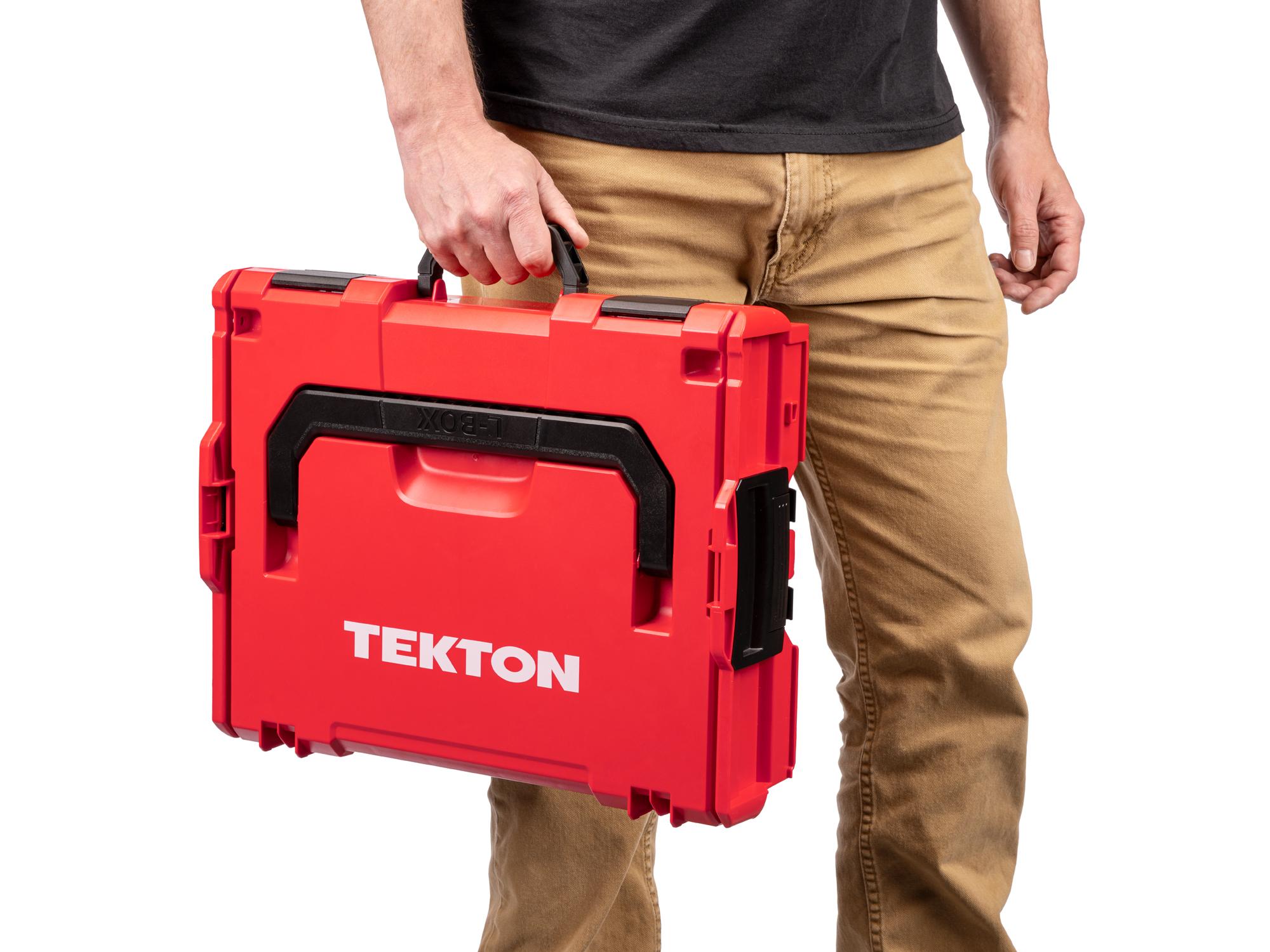 A person holding a red Tekton stacking organization tool box by the side black handle. Item #OLB91004.