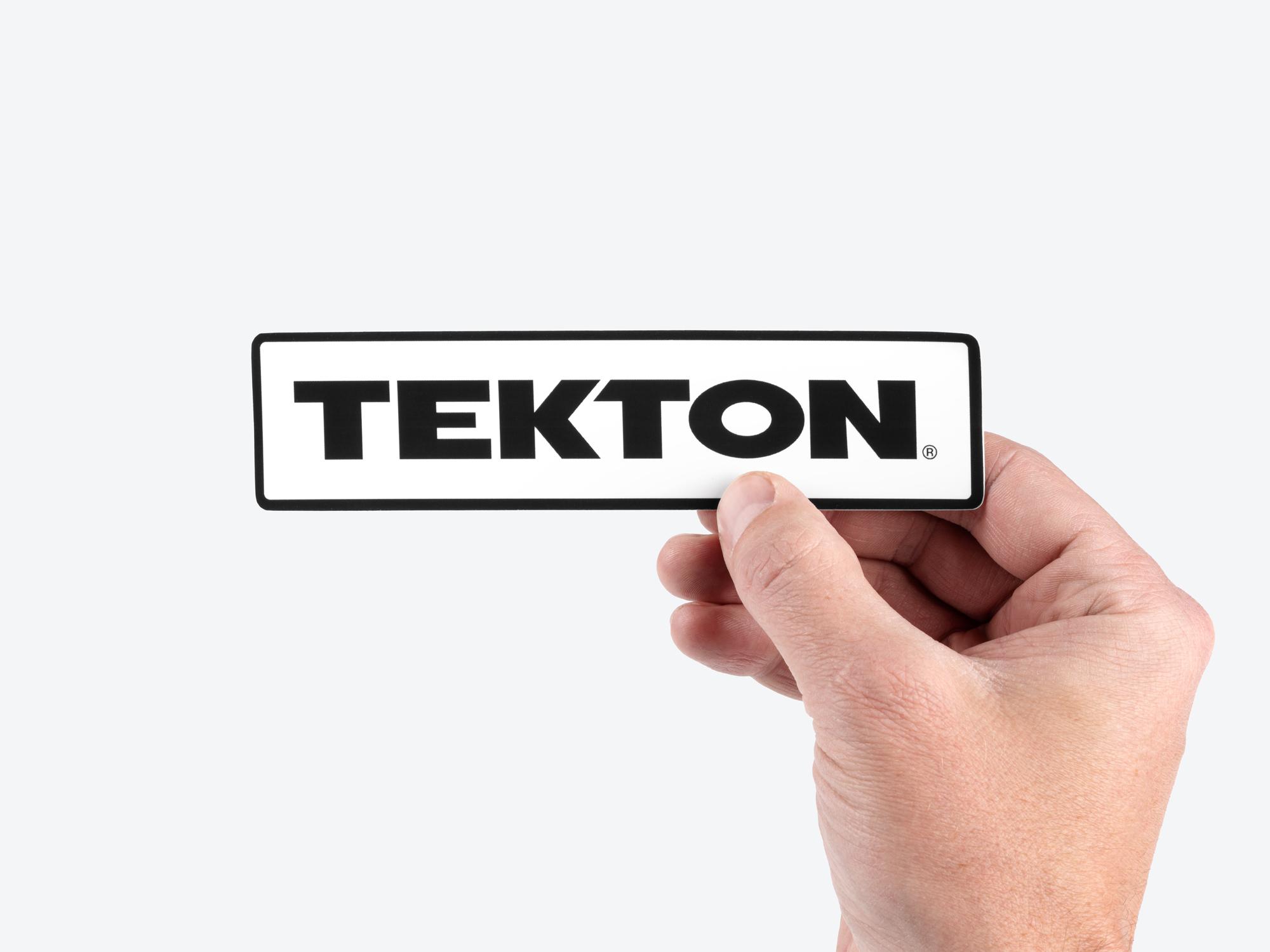 Person holding Tekton sticker. Item #APG51004
