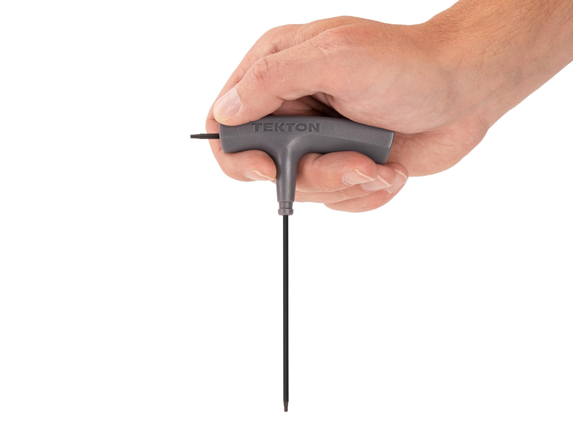 Person holding Tekton t-handle key. Item #KTT32070