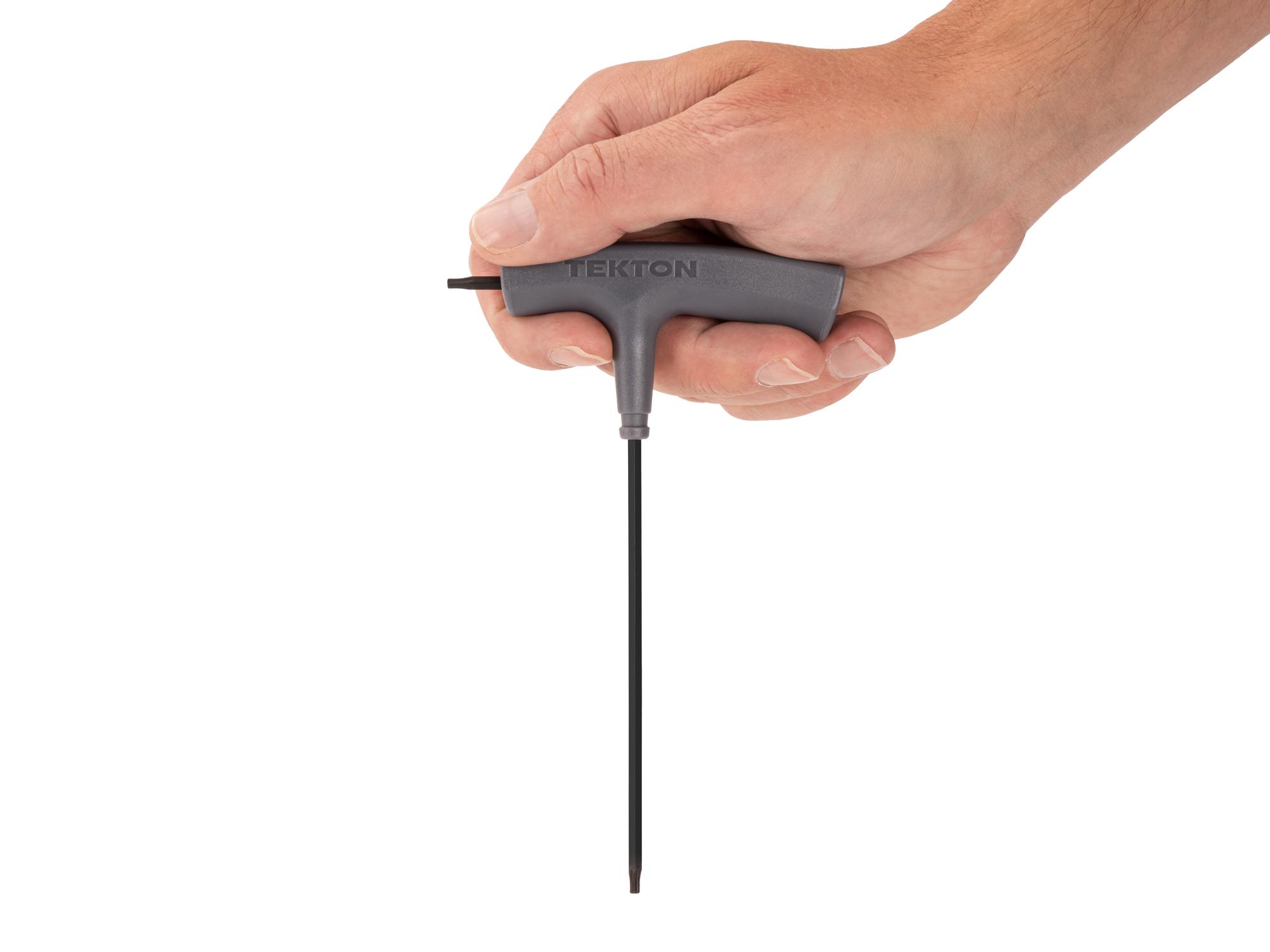 Person holding Tekton t-handle key. Item #KTT32100