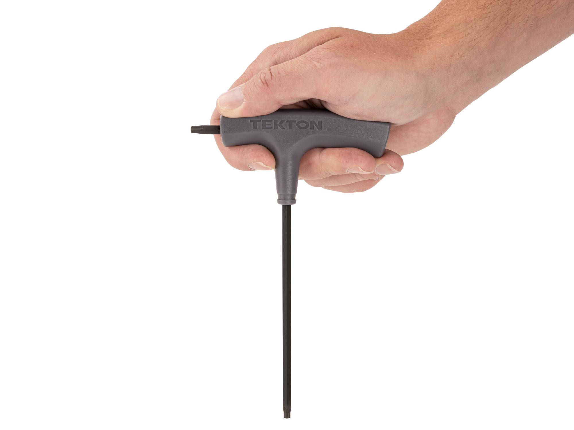 Person holding Tekton t-handle key. Item #KTT32250