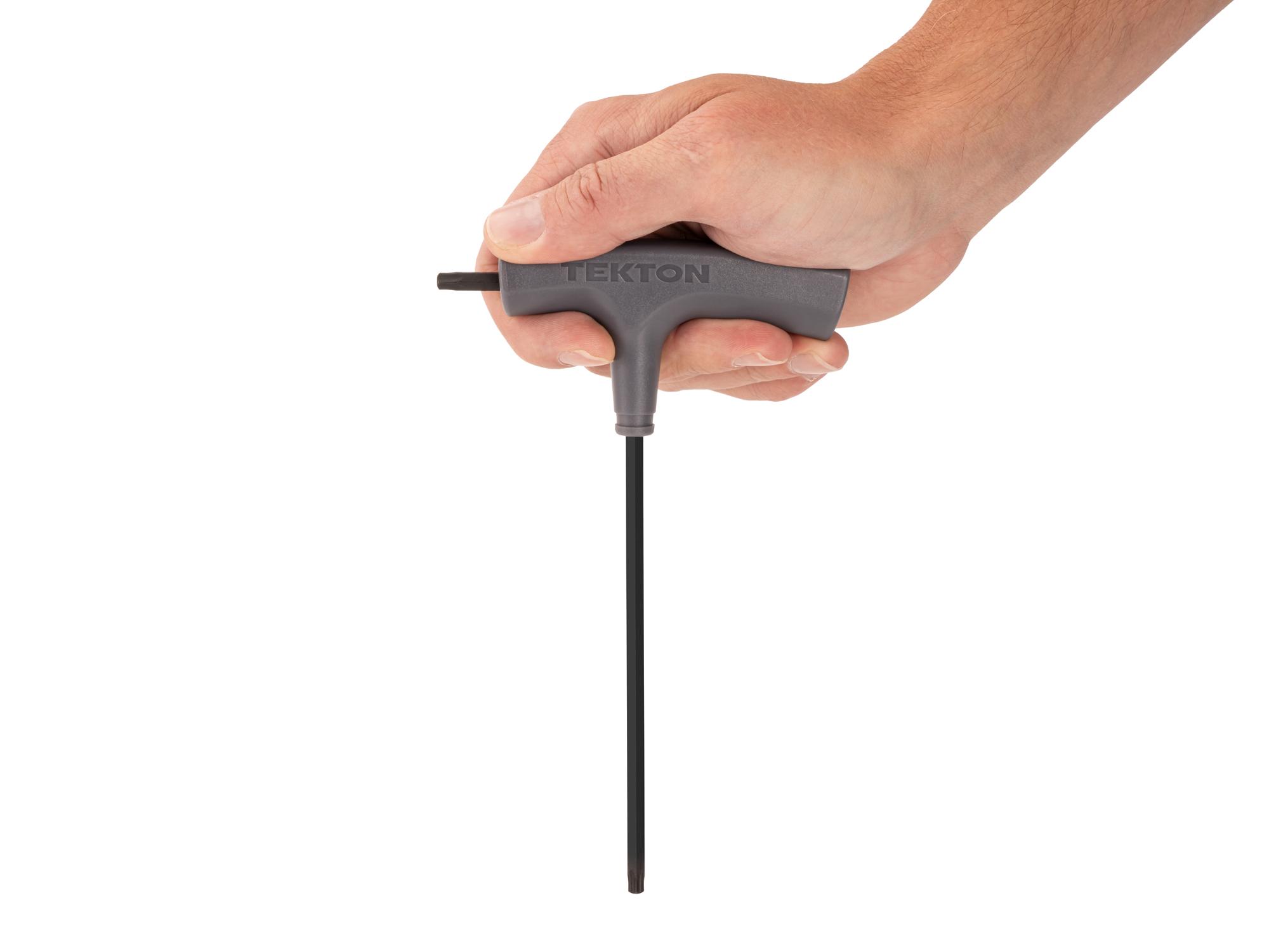 Person holding Tekton t-handle key. Item #KTT32270