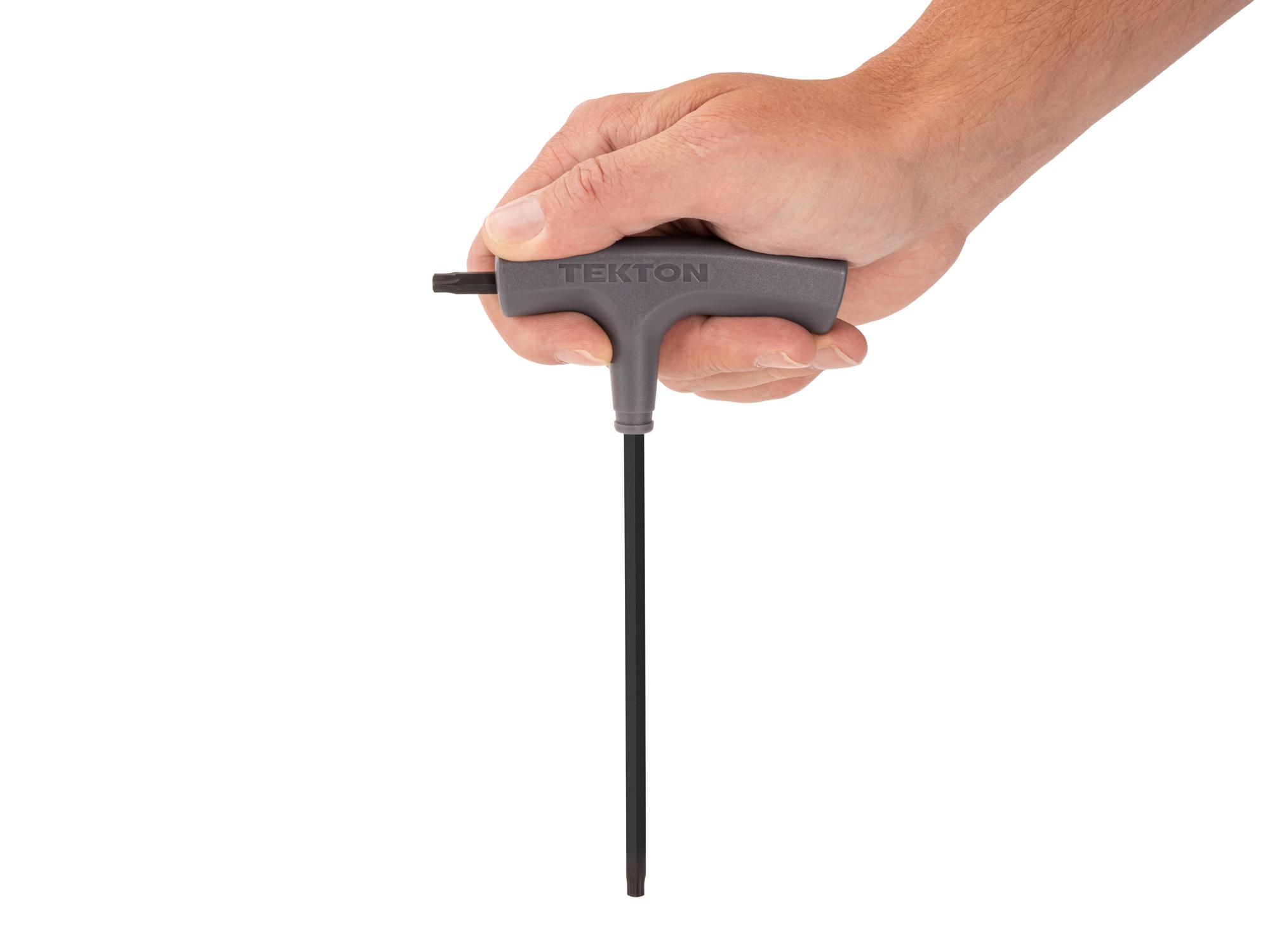 Person holding Tekton t-handle key. Item #KTT32300