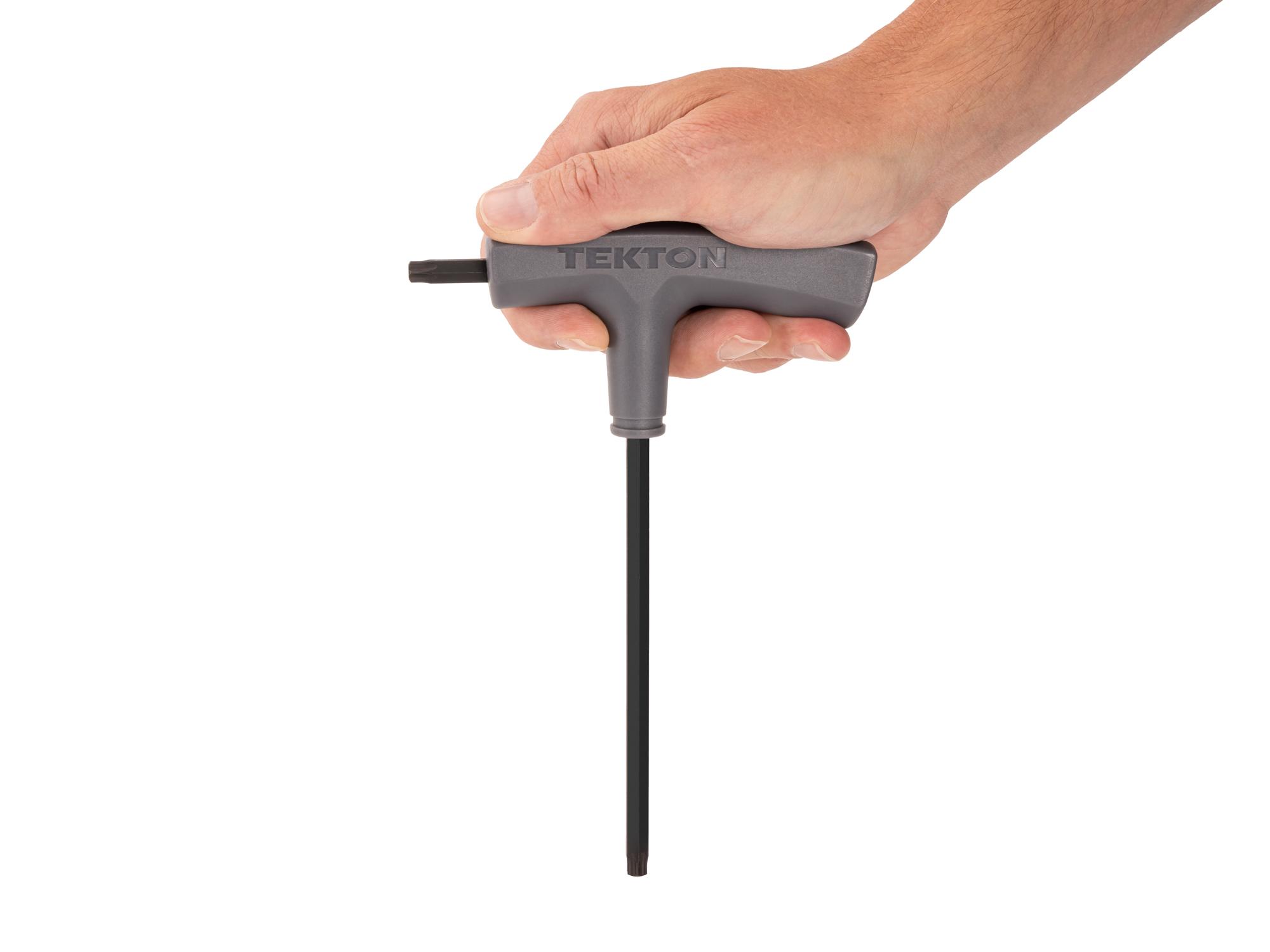 Person holding Tekton t-handle key. Item #KTT32400