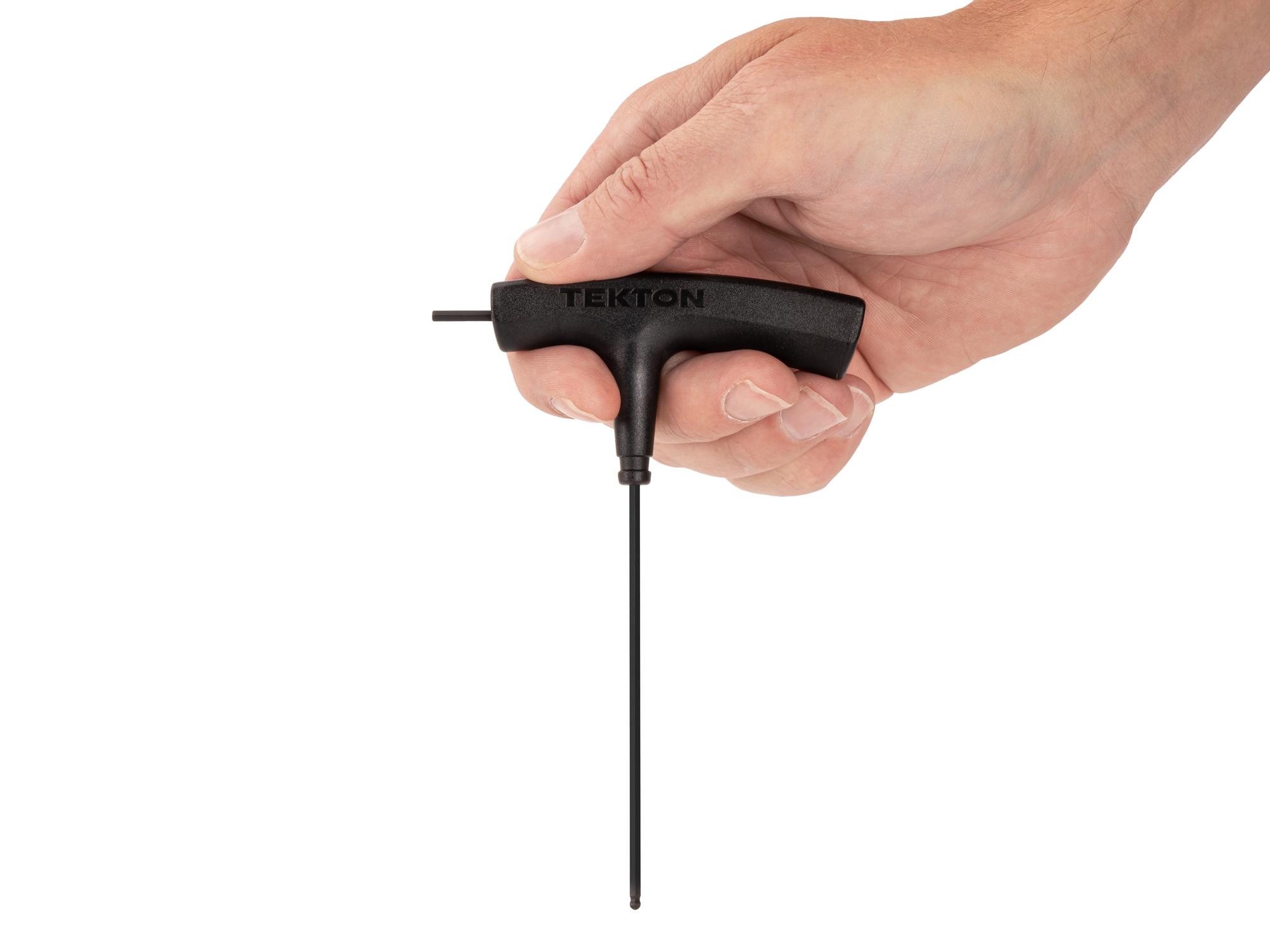 Person holding Tekton t-handle key. Item #KTX37094