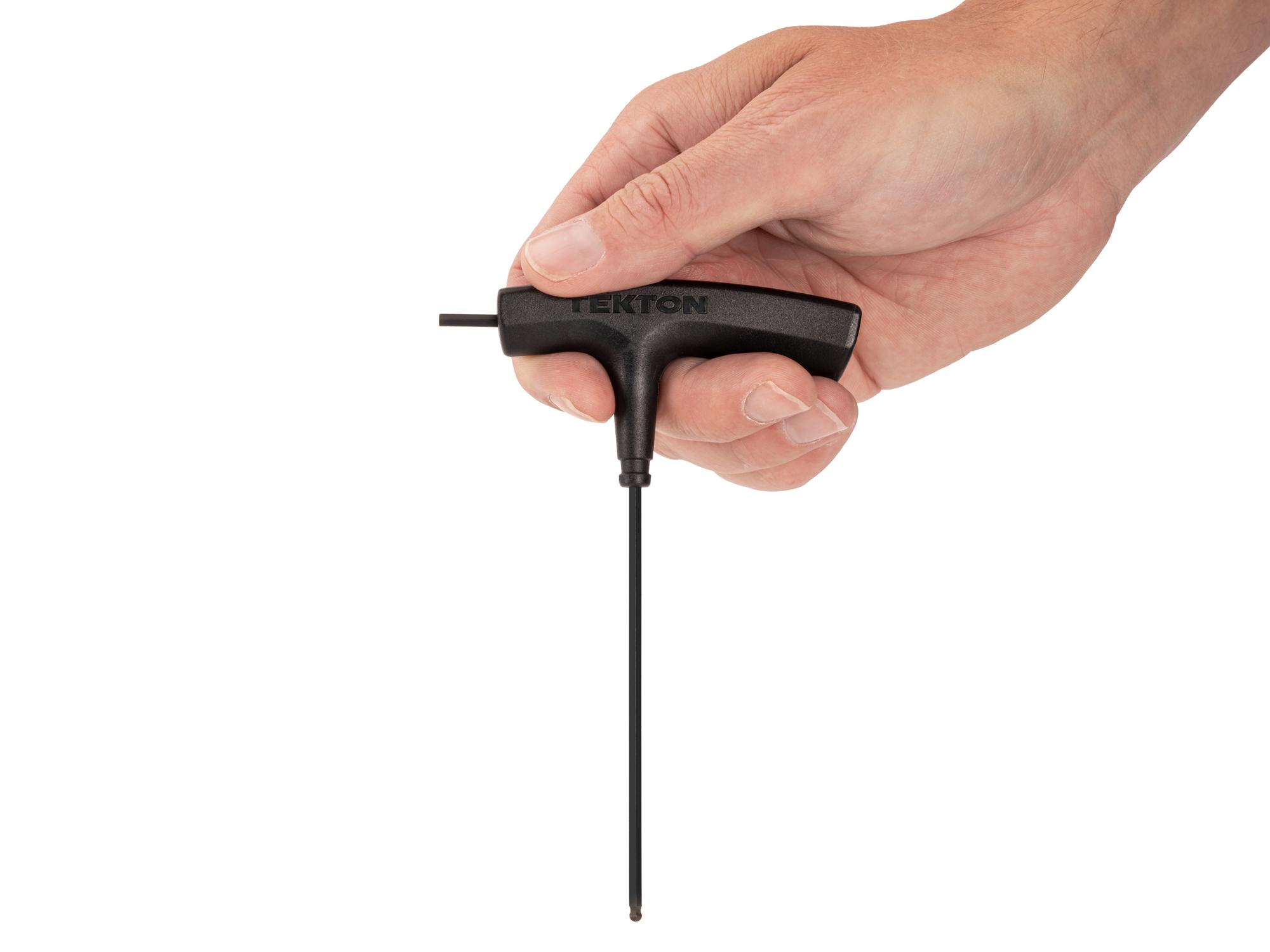 Person holding Tekton t-handle key. Item #KTX37109