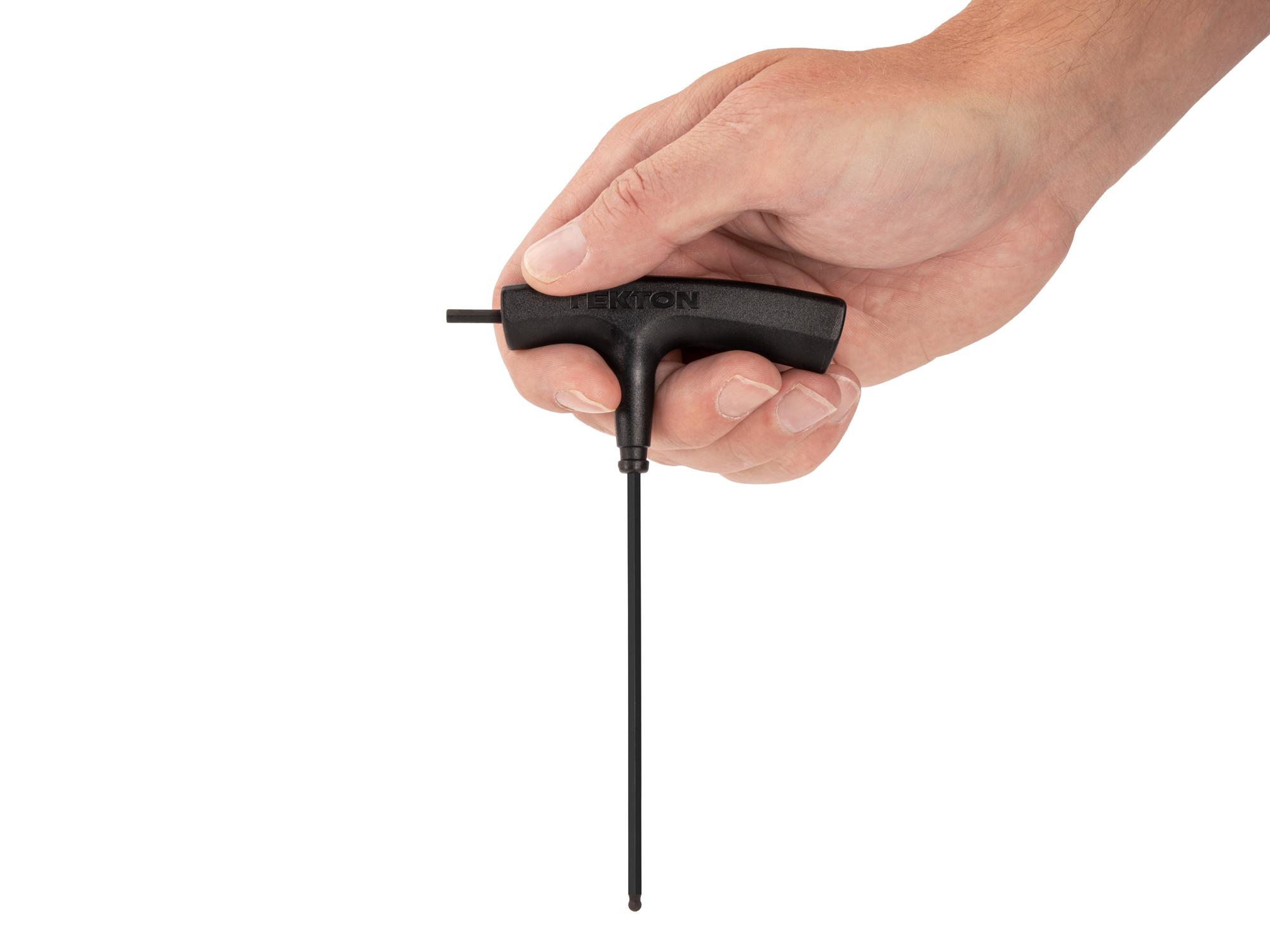 Person holding Tekton t-handle key. Item #KTX37125