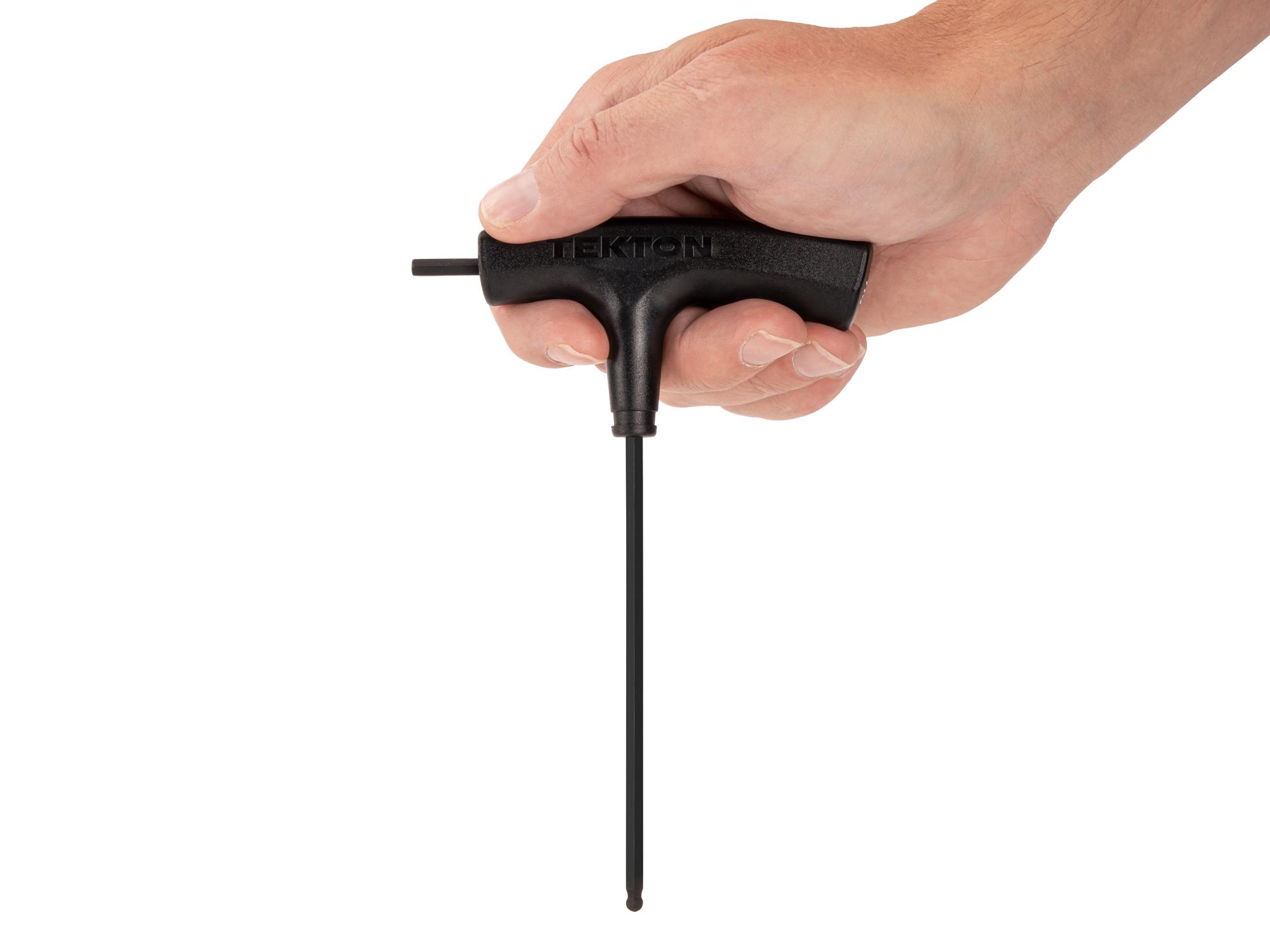 Person holding Tekton t-handle key. Item #KTX37141