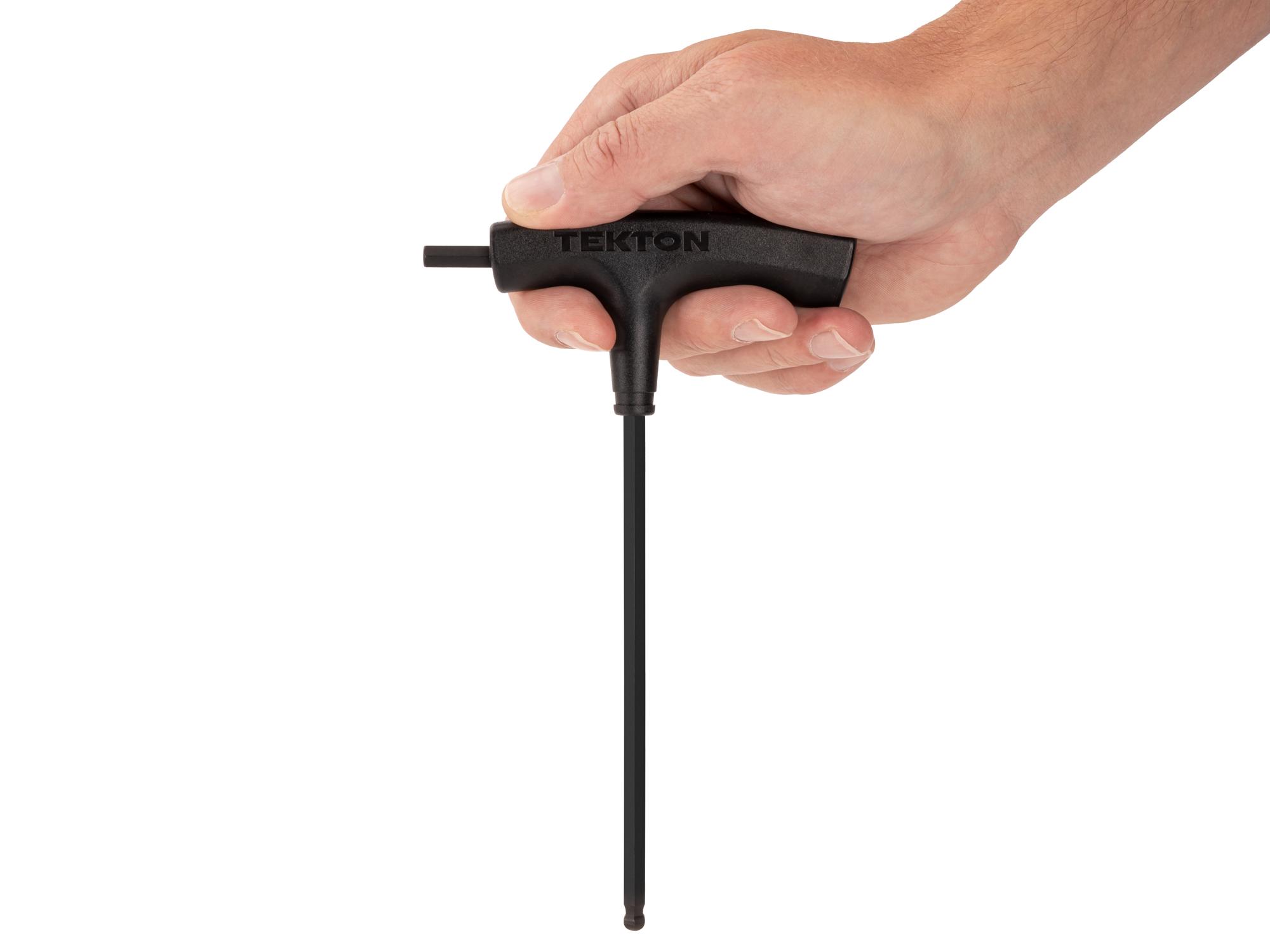 Person holding Tekton t-handle key. Item #KTX37219