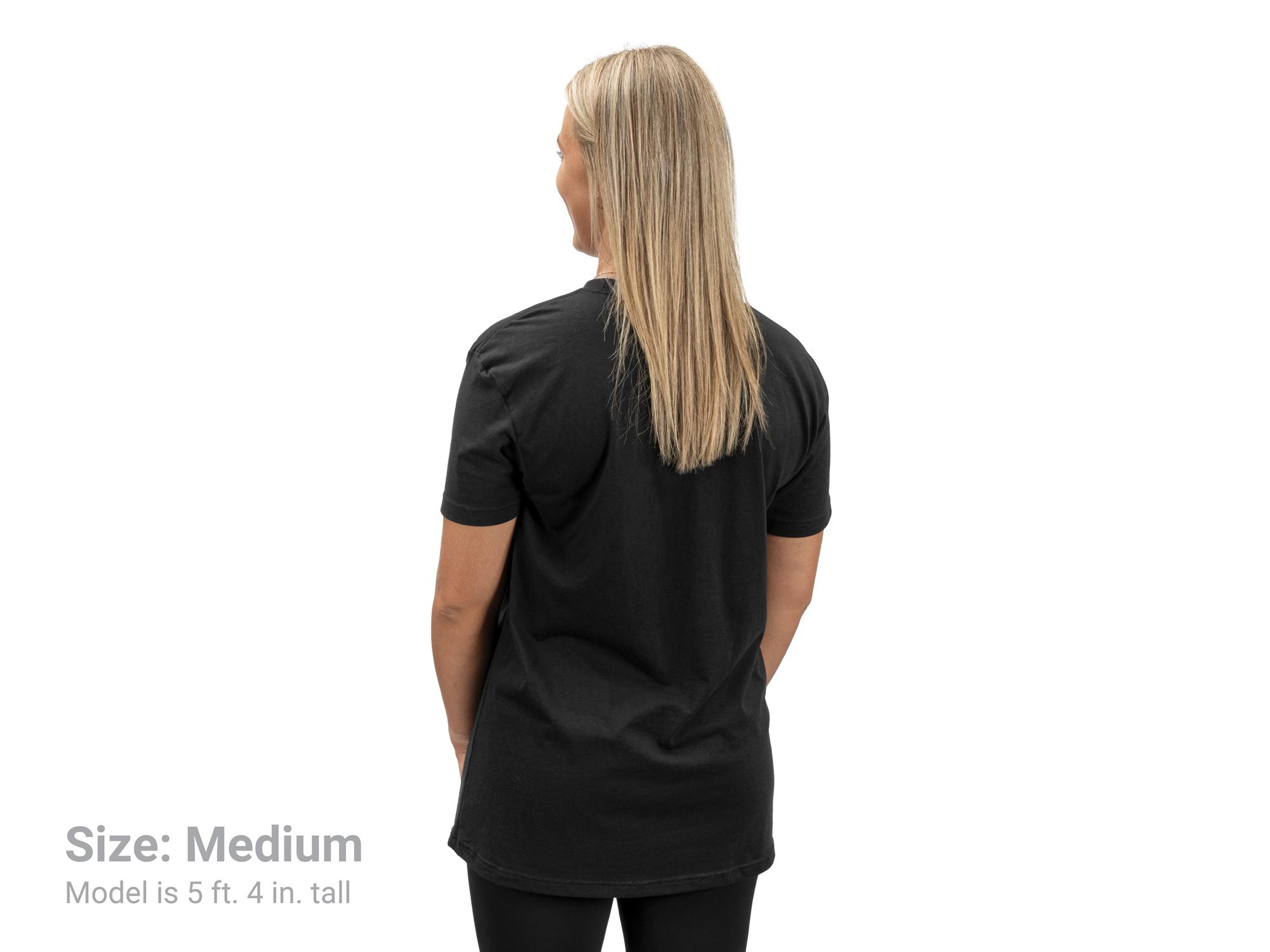 Back view of a woman wearing a black Tekton tee. Item #APG32026