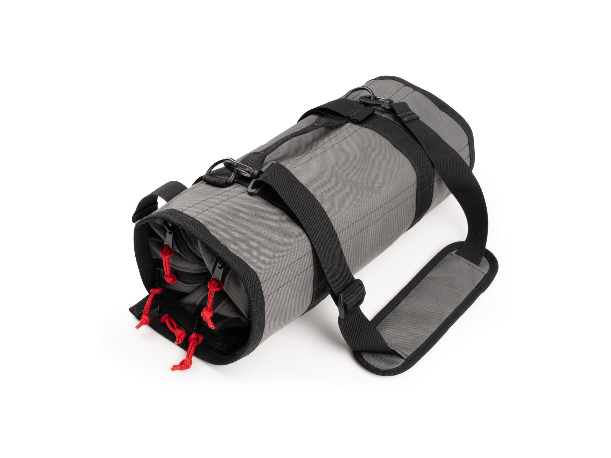 Closed top front-right angle view of tactical-gray-red Tekton roll tool pouch. Item #EXP00011