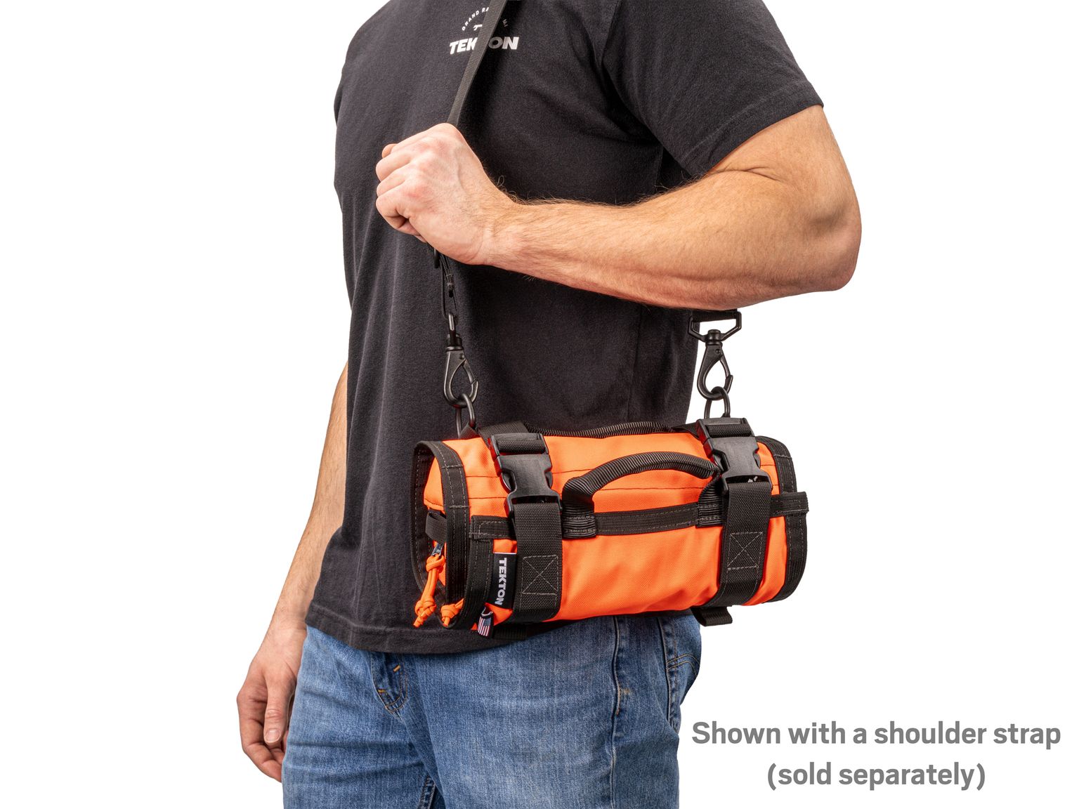 Person holding high-vis-orange Tekton tool roll. Item #OTR00003