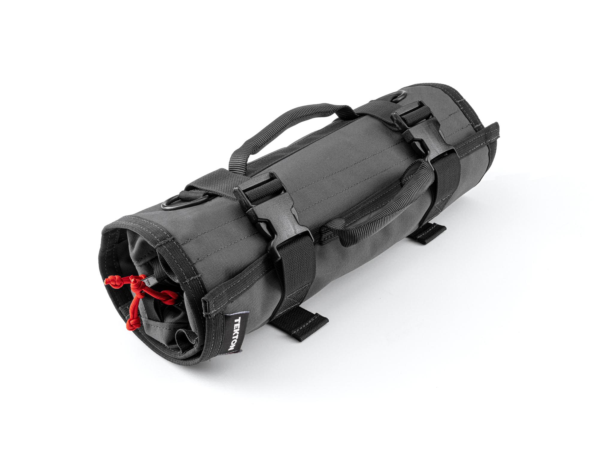 Closed top front-right angle view of tactical-gray-red Tekton roll tool roll. Item #OTR00004