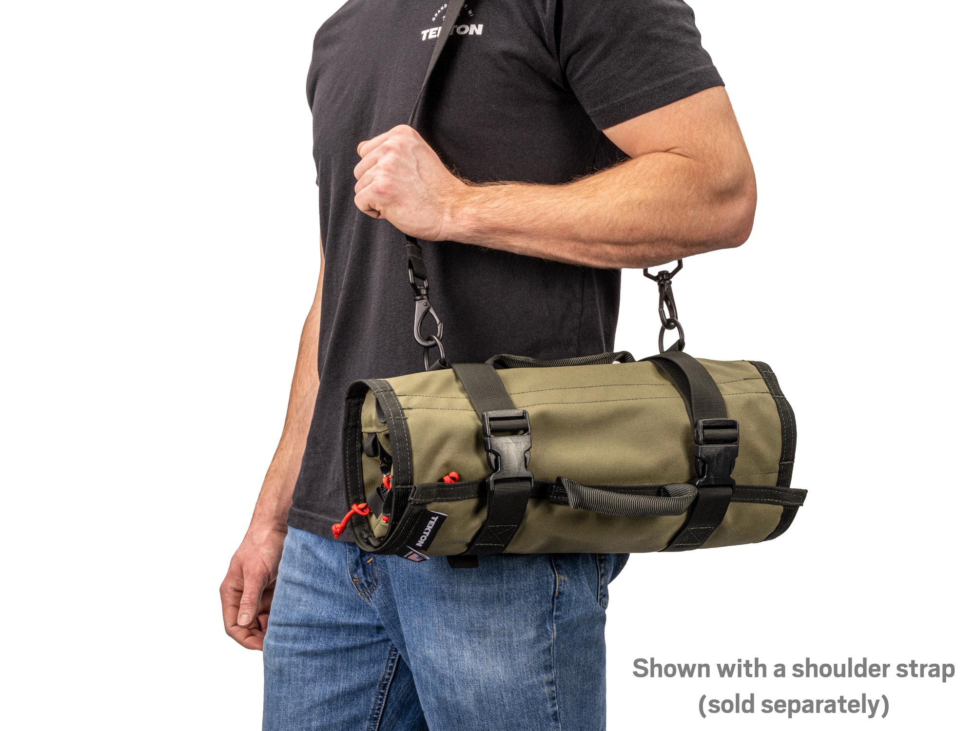 Person holding ranger-green-red Tekton roll tool roll. Item #OTR00005
