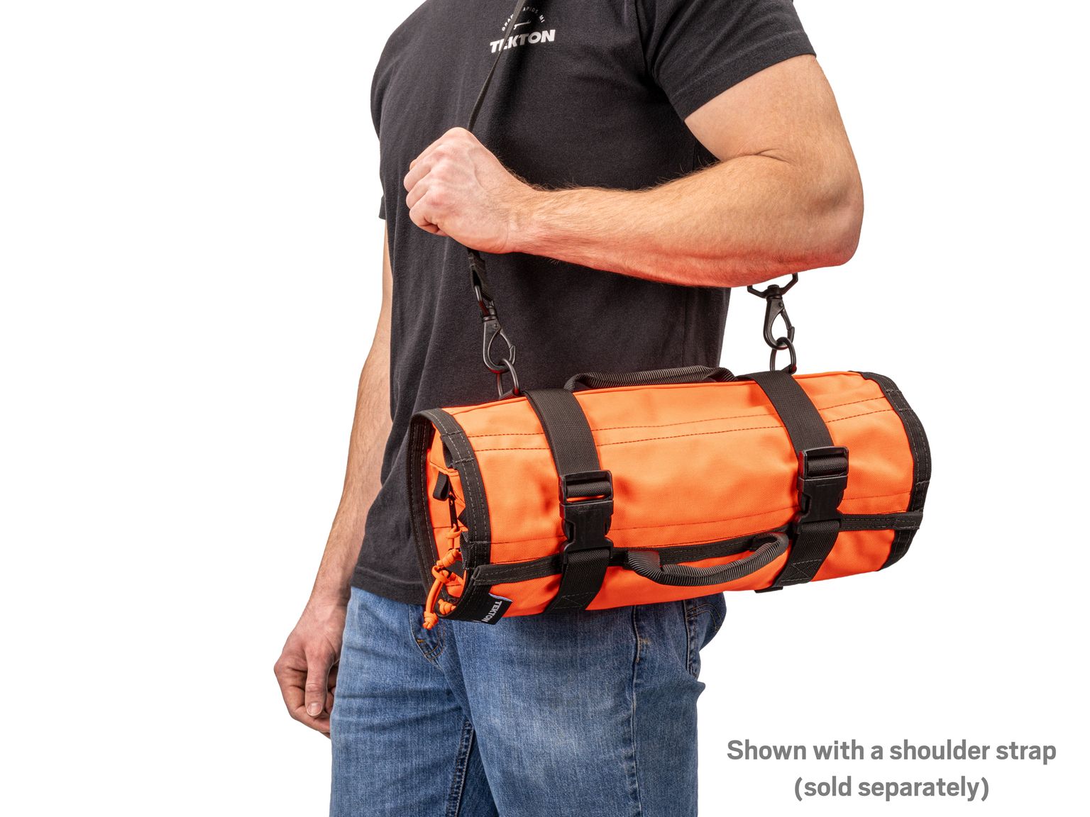 Person holding high-vis-orange Tekton tool roll. Item #OTR00006