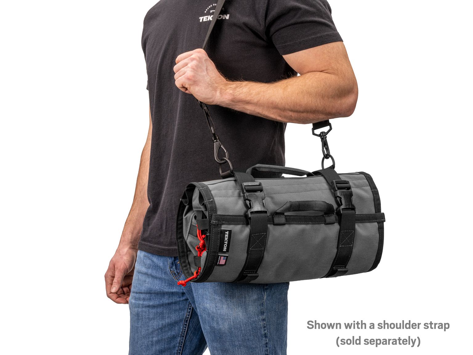 Person holding tactical-gray-red Tekton tool pouch. Item #OTR00007