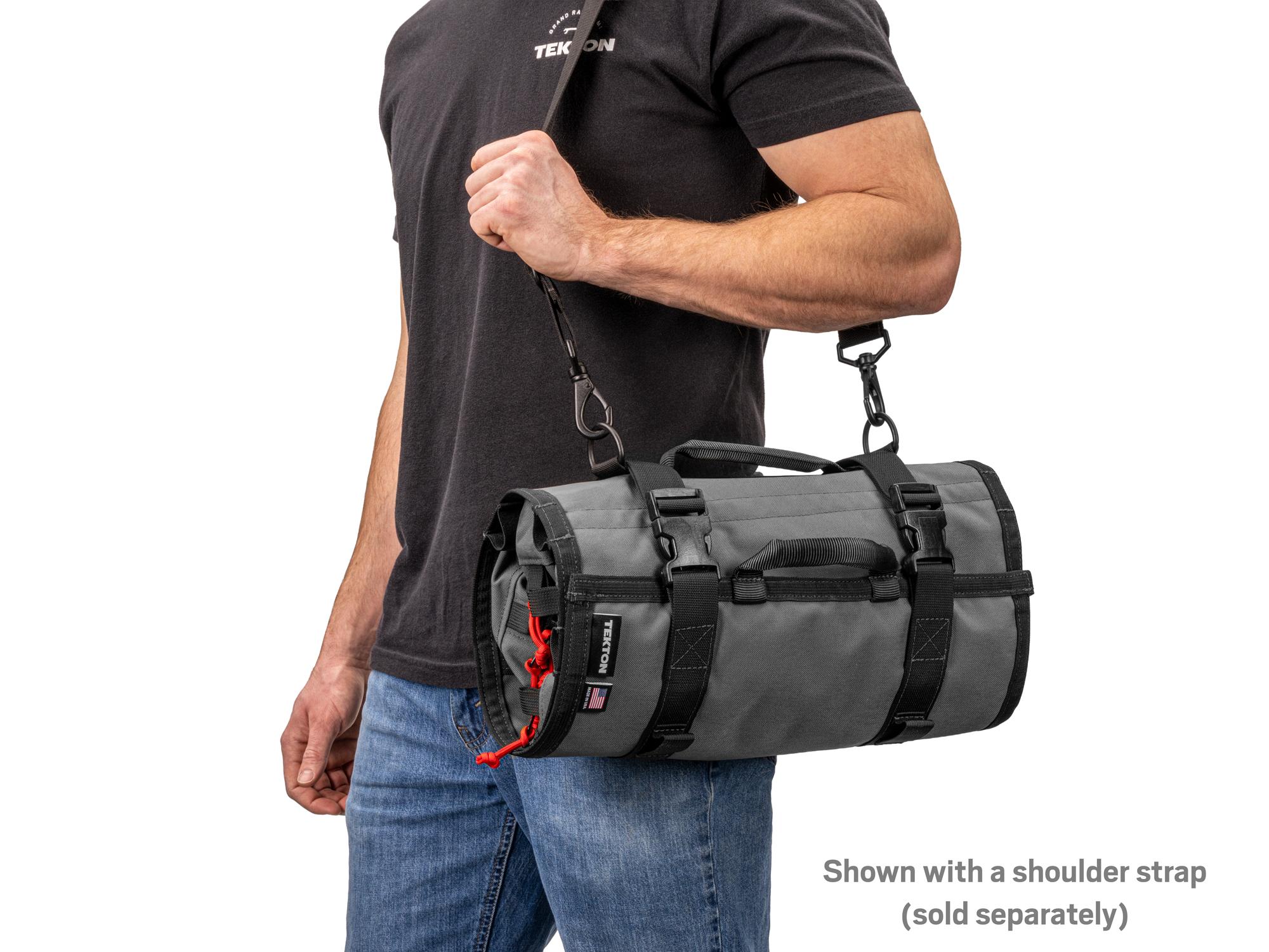 Person holding tactical-gray-red Tekton roll tool roll. Item #OTR00007