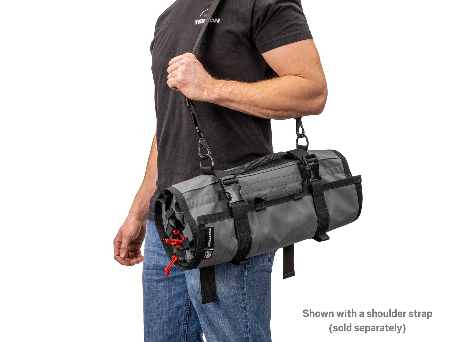 Person holding tactical-gray-red Tekton tool pouch. Item #OTR00010