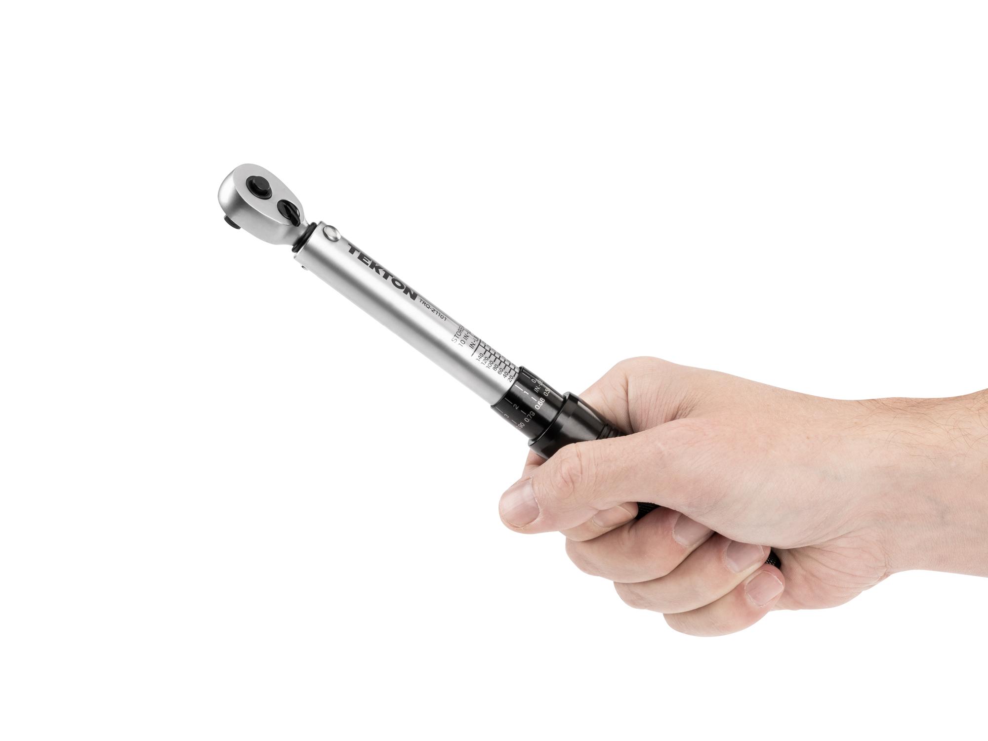 Person holding Tekton case torque wrench set. Item #TRQ21101