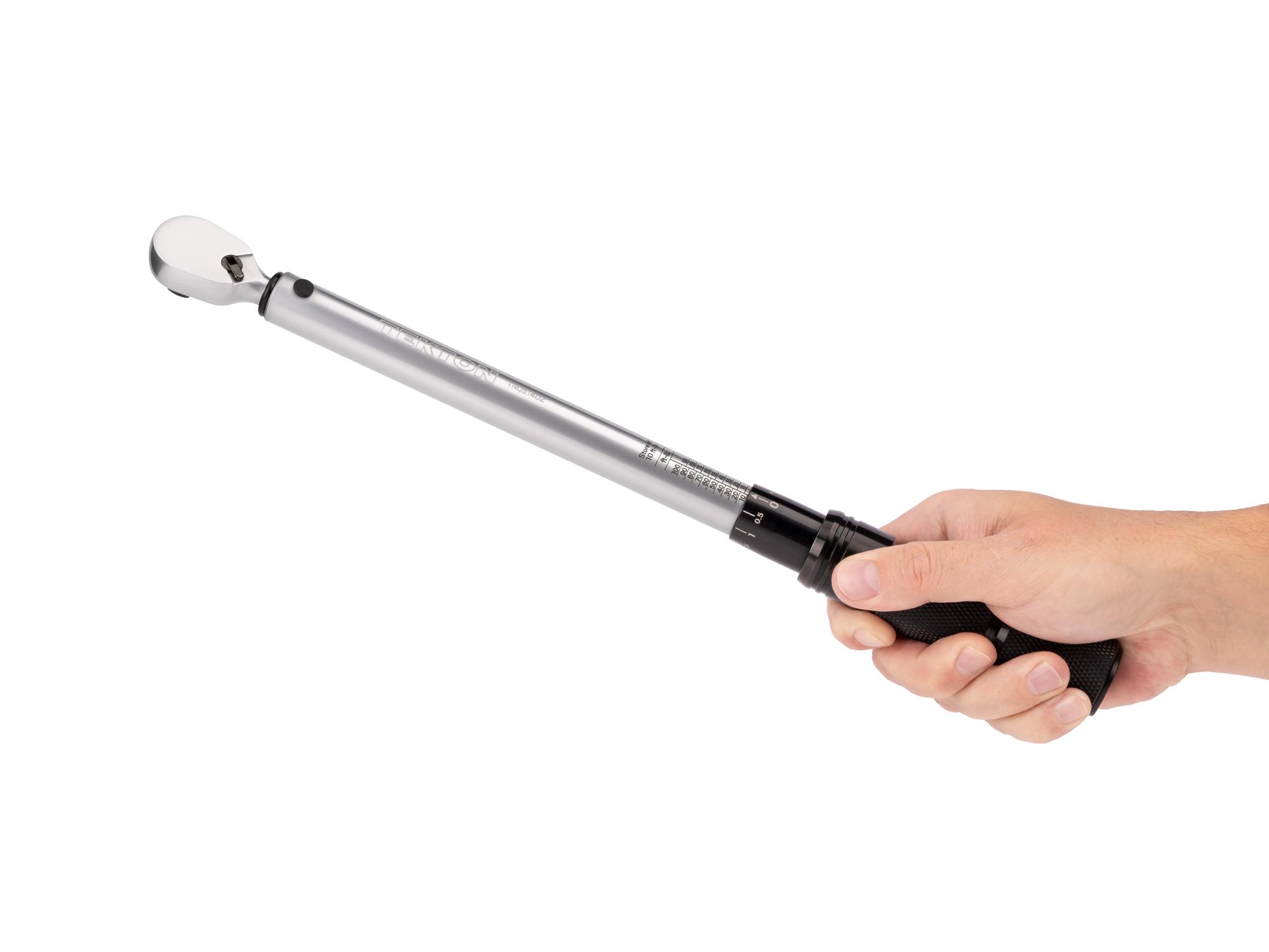 Person holding Tekton case micrometer torque wrench. Item #TRQ51402