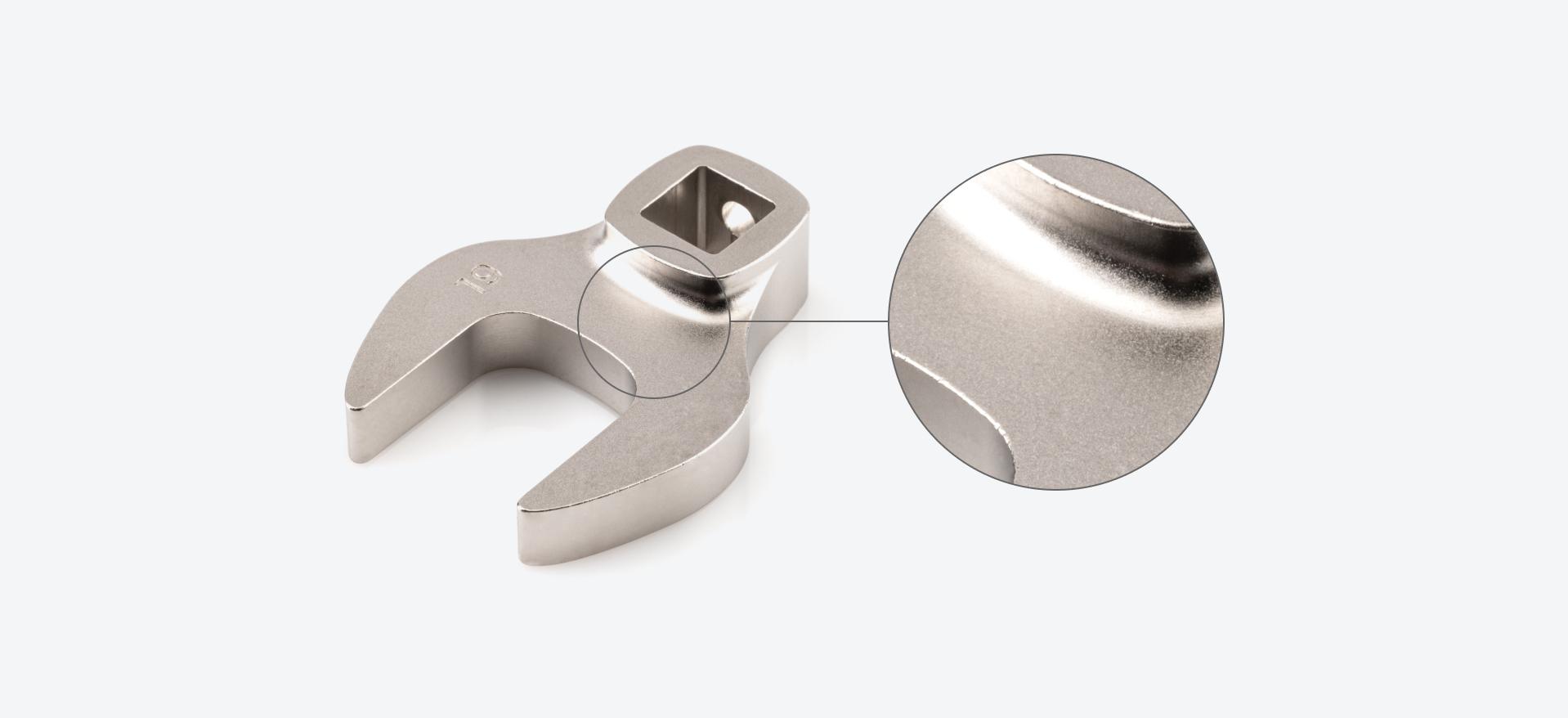 Close-up of a crowfoot wrench with a smooth, satin electroless nickel finish.