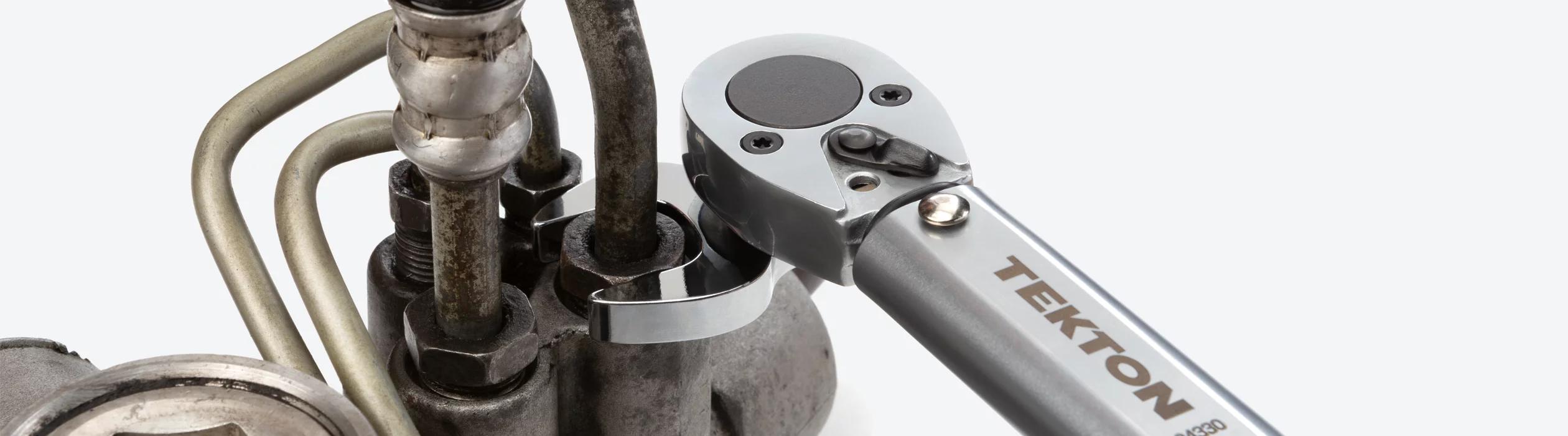 Tekton crowfoot wrench on a torque wrench tightening a fastener